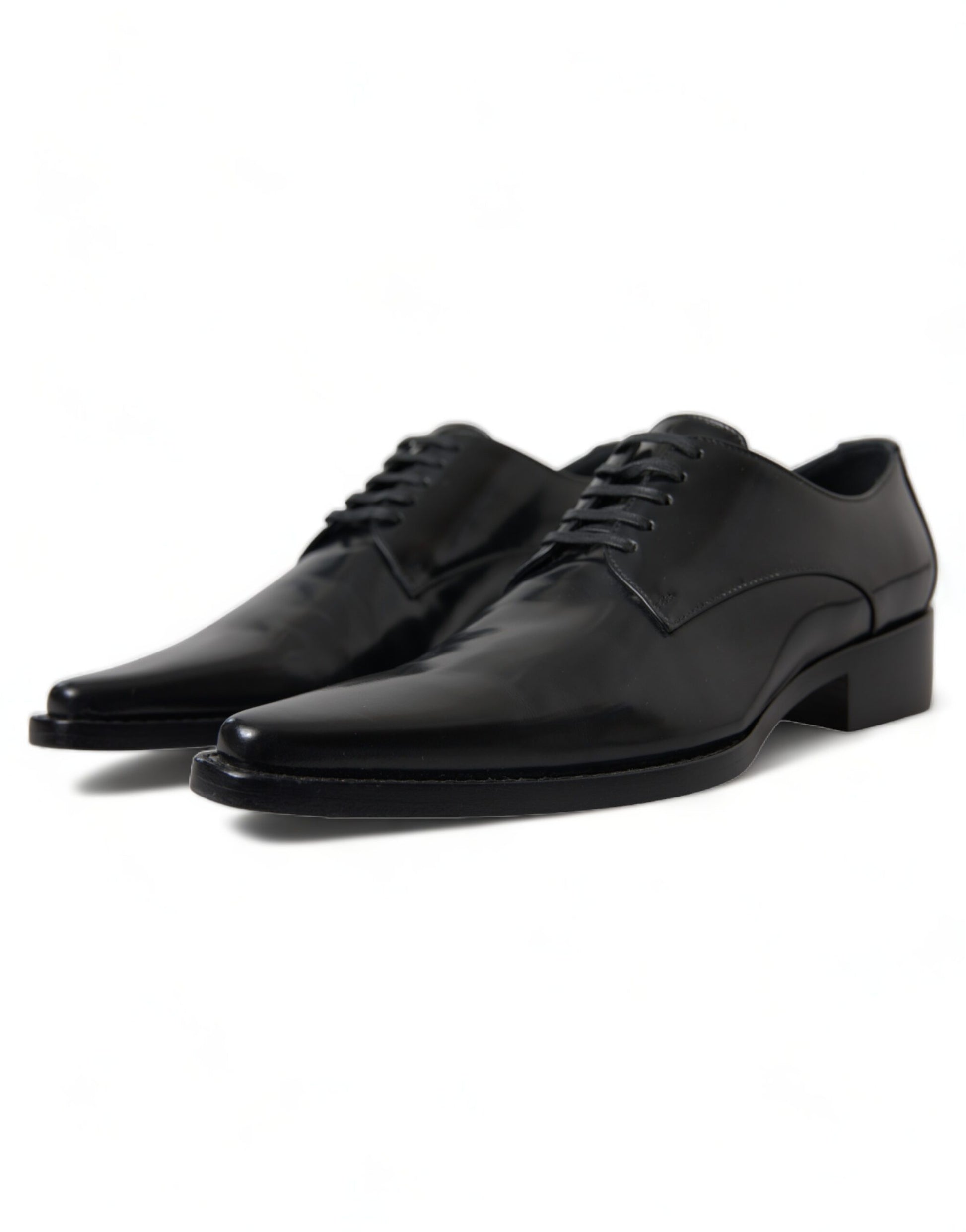 Pair of black dress shoes with laces and a small heel