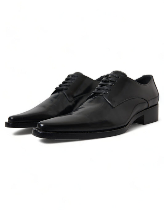 Pair of black dress shoes with laces and a small heel