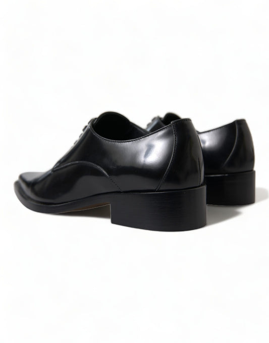 Pair of black shoes with a chunky heel and a pointed toe