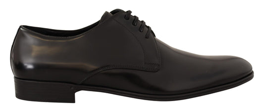 Black leather dress shoe with laces and a small heel