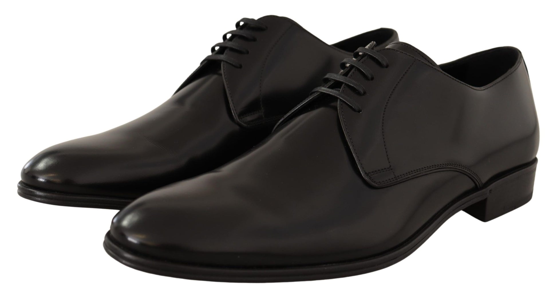 Pair of black dress shoes with laces and a shiny finish