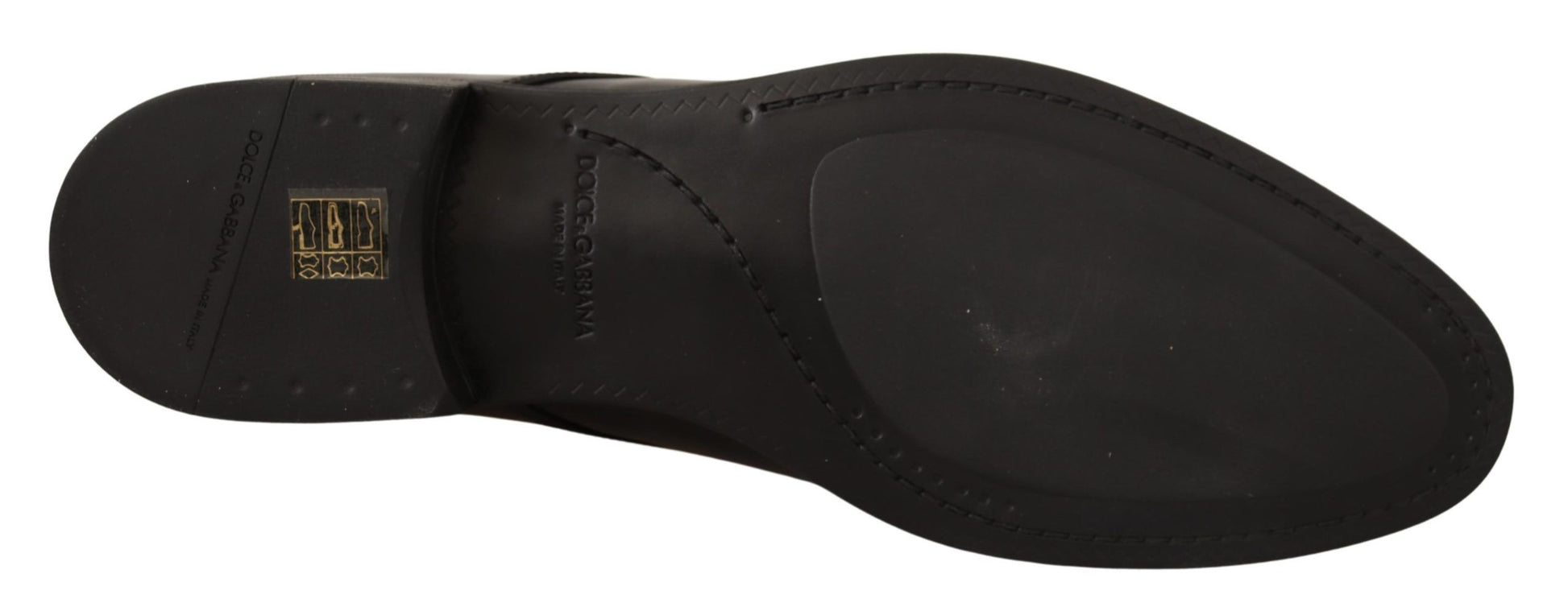 Pair of black shoes with yellow logo on side