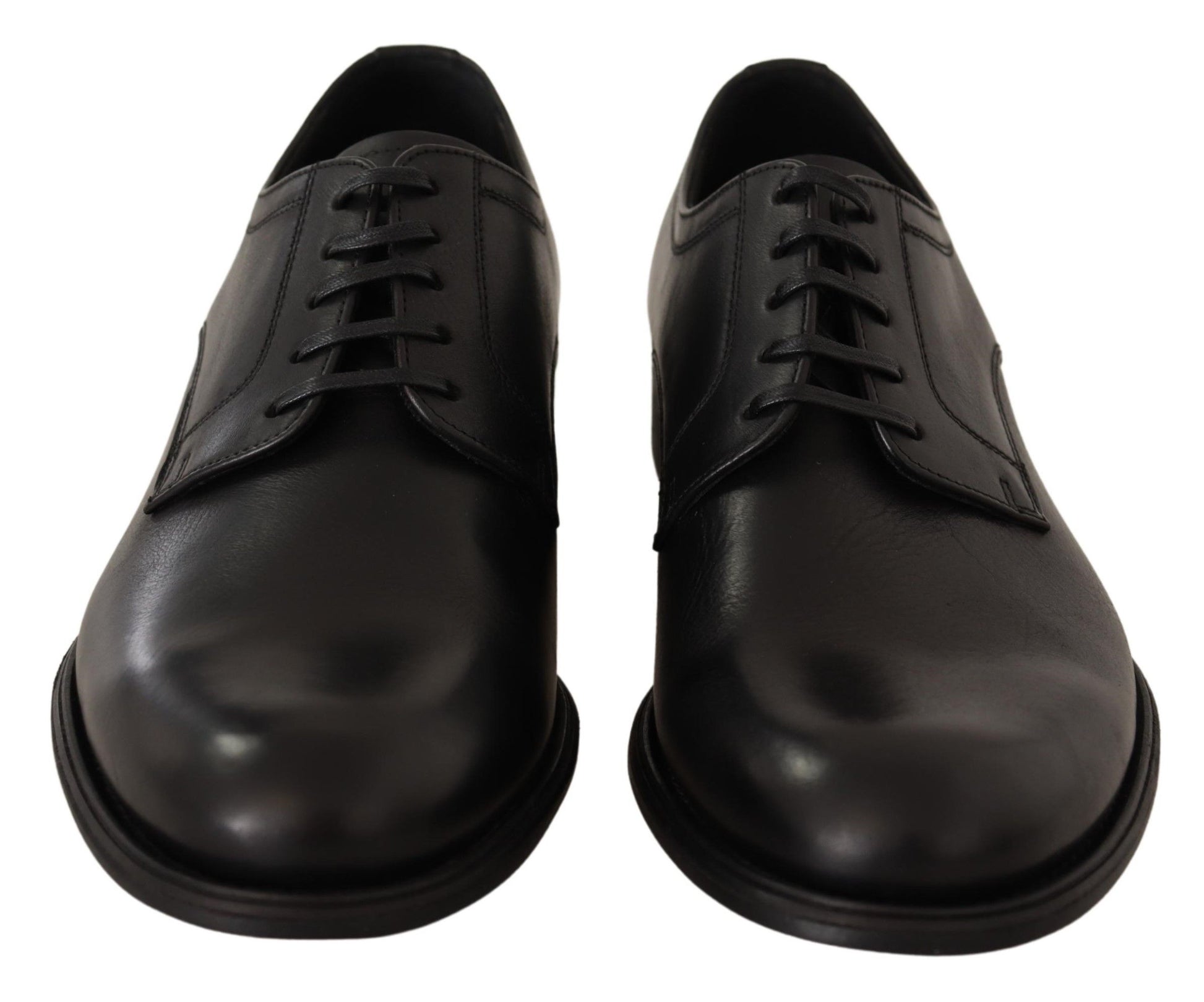 Pair of black leather dress shoes with laces and a strap across the top