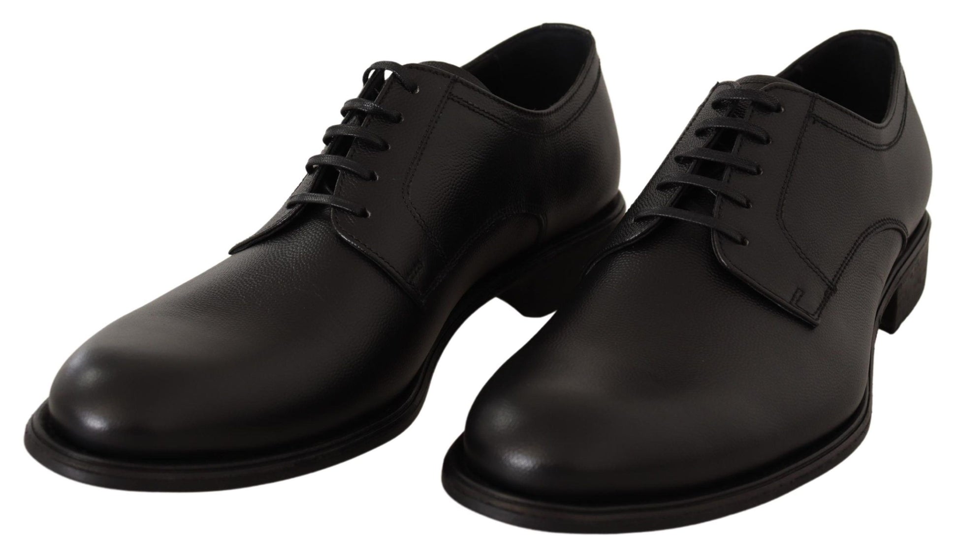 Pair of black leather dress shoes with laces and buckles