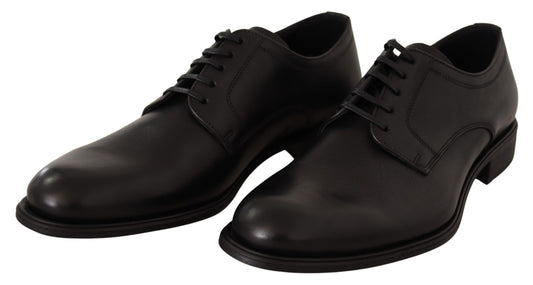 Pair of black lace-up shoes with a shiny finish