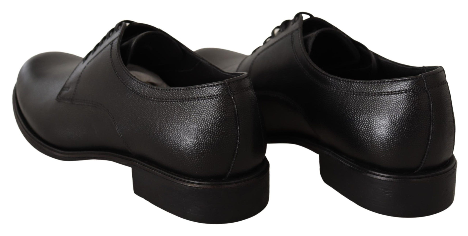 Pair of black leather shoes with laces and a small heel
