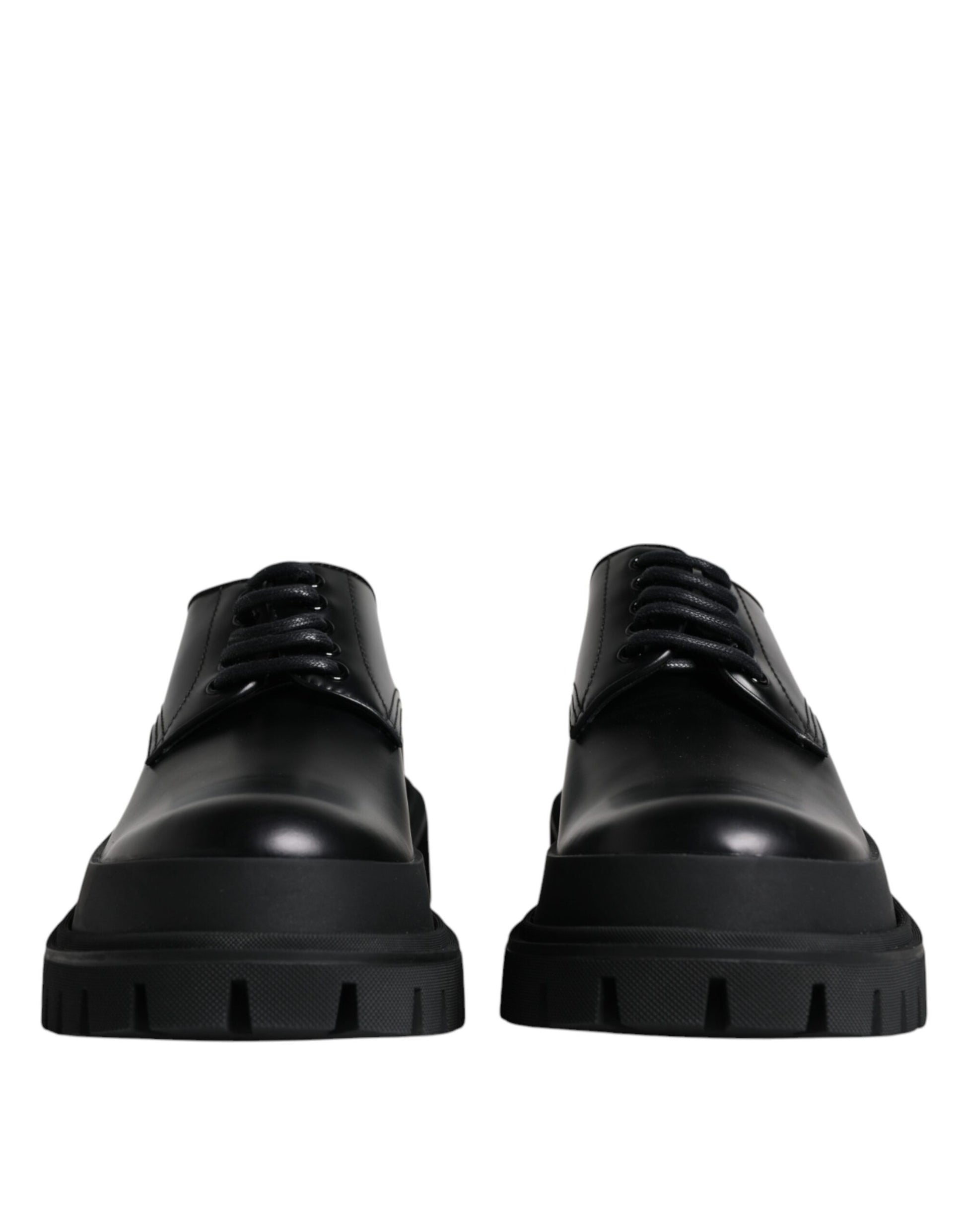 Pair of black leather lace-up dress shoes with a chunky sole