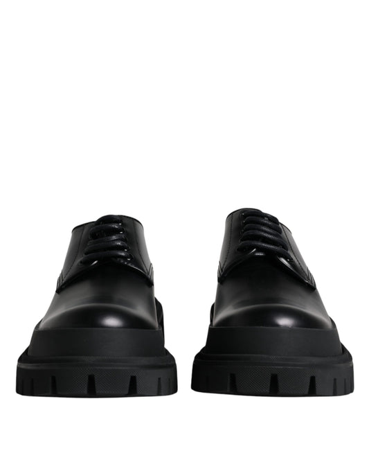 Pair of black leather lace-up dress shoes with a chunky sole