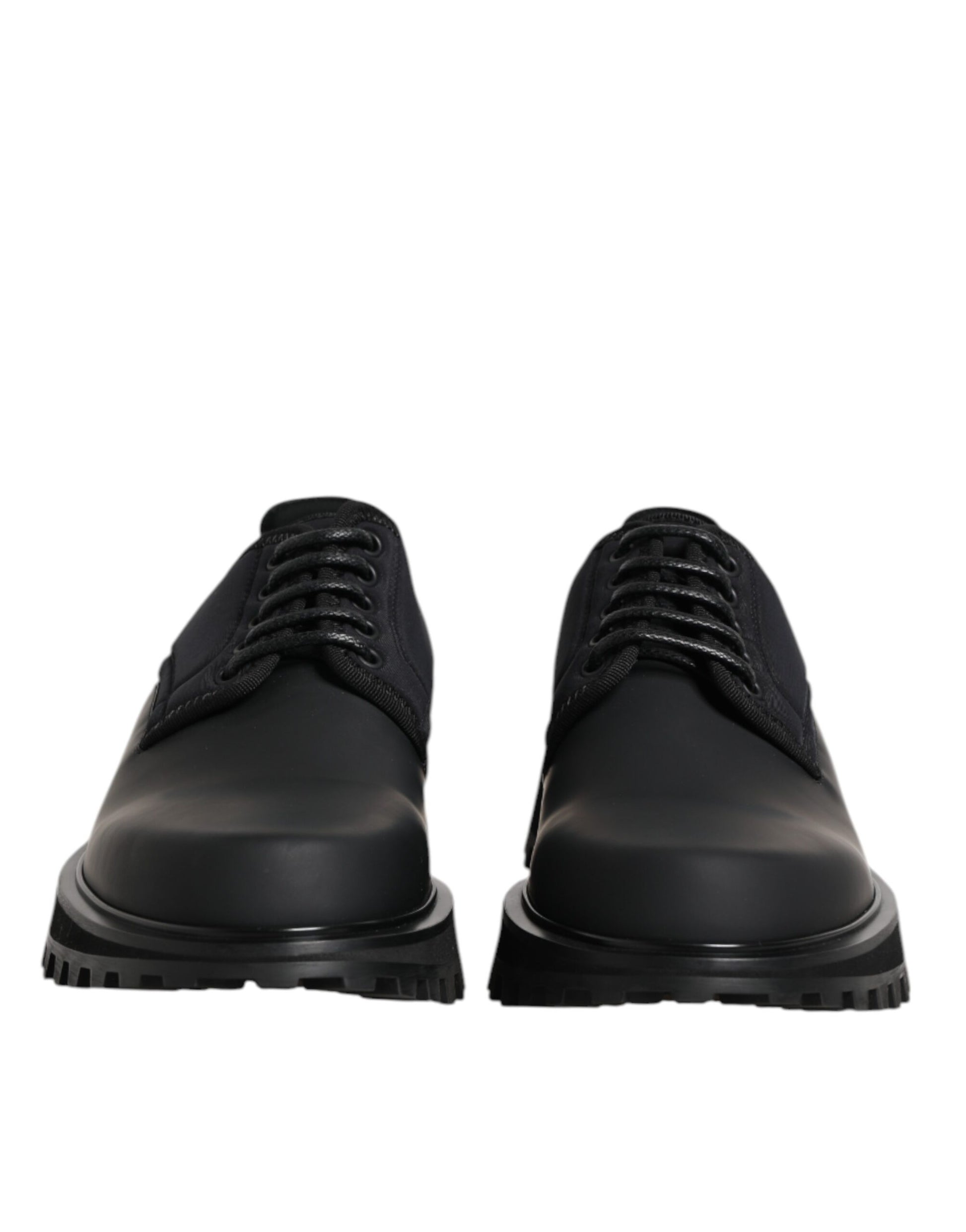 Pair of black leather lace-up shoes with silver eyelets and a low heel