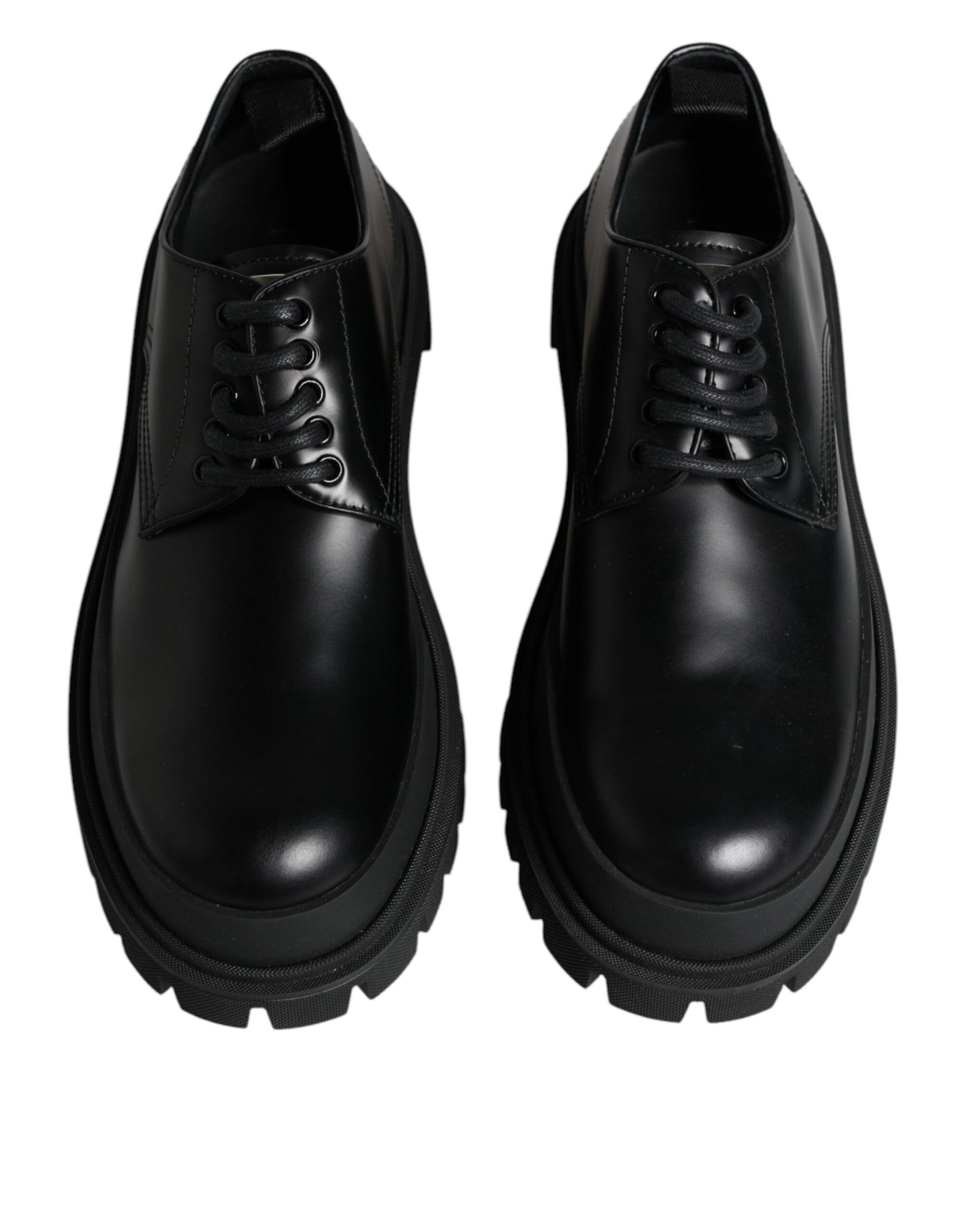 Pair of black leather lace-up shoes with white stripes on sides