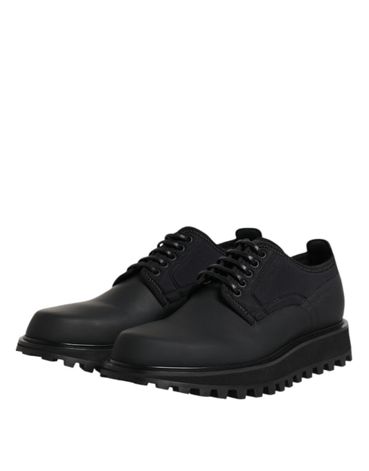 Pair of black leather lace-up shoes with rubber sole, designed for trekking and dress wear