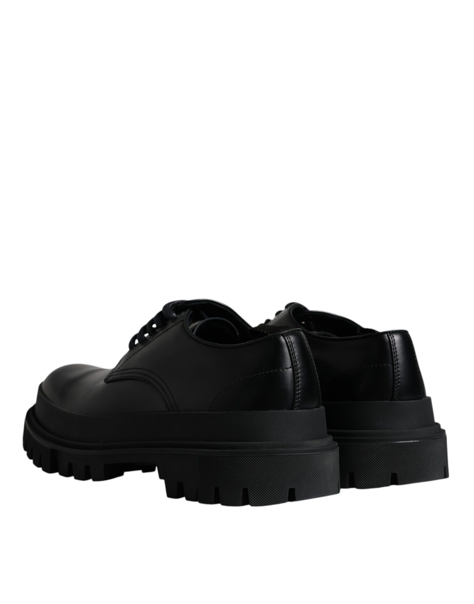 A pair of black leather lace-up shoes with a chunky sole and a trekking design