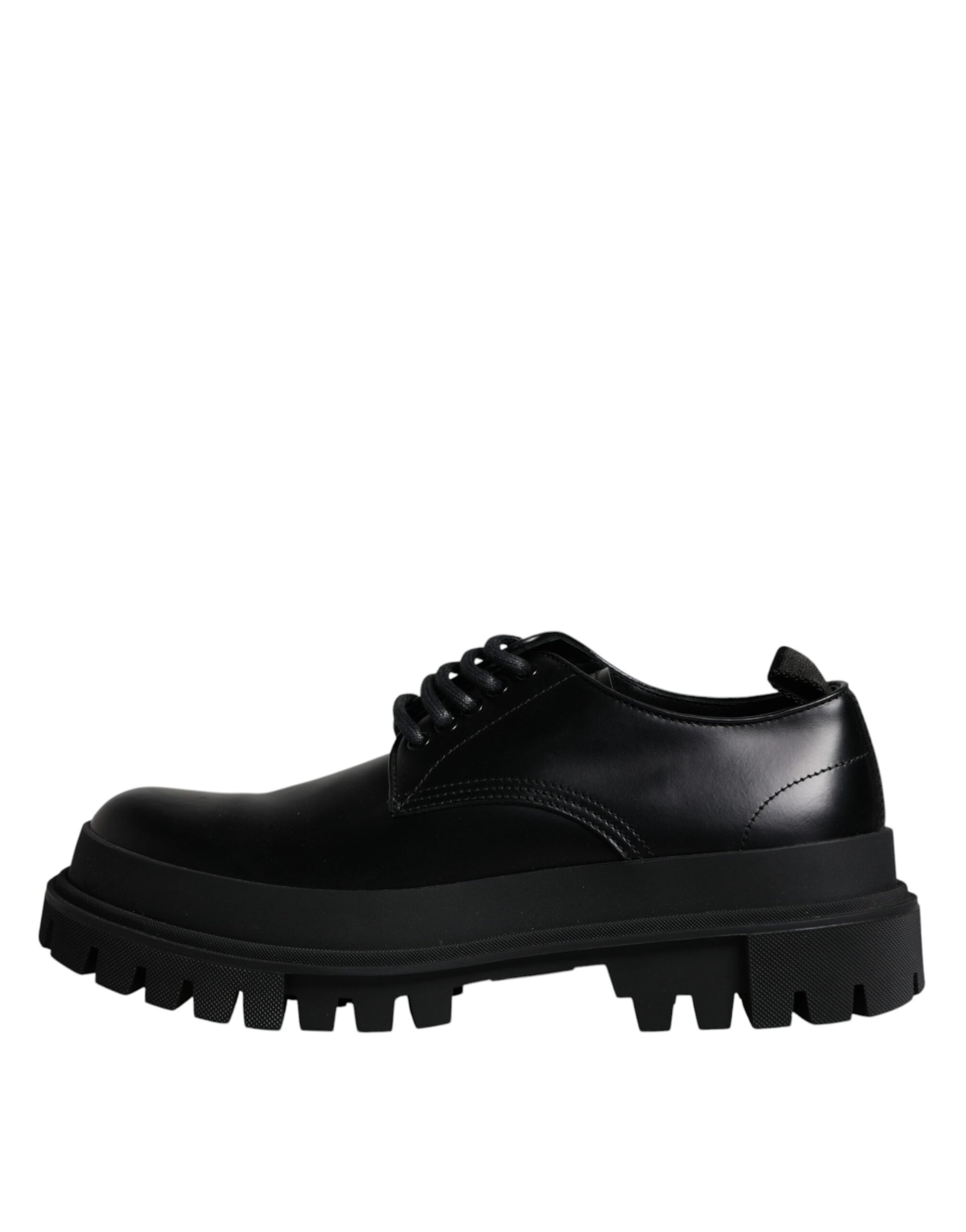 A pair of black leather lace-up shoes with a chunky sole and silver hardware