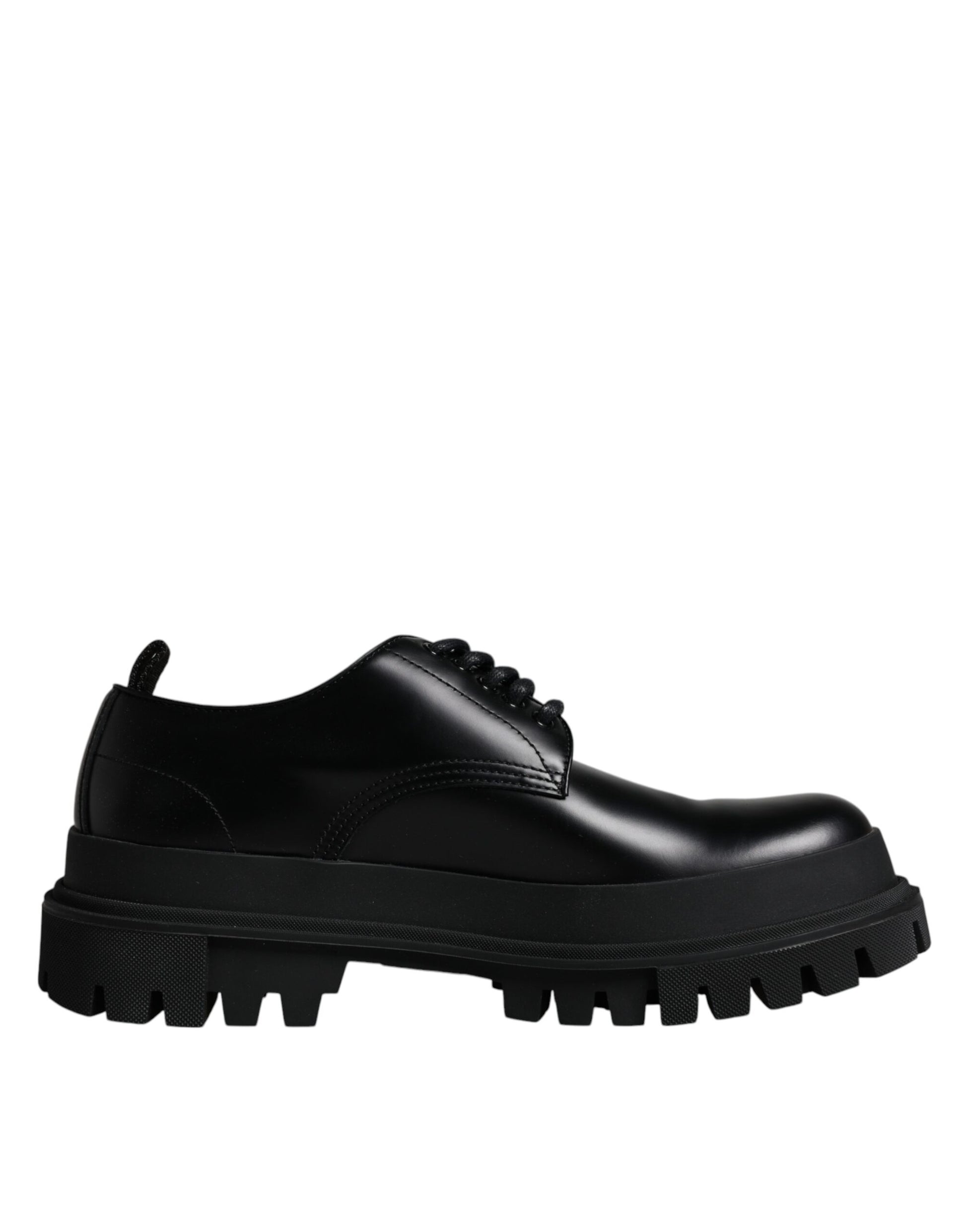 A pair of black leather lace-up shoes with a chunky sole and silver hardware
