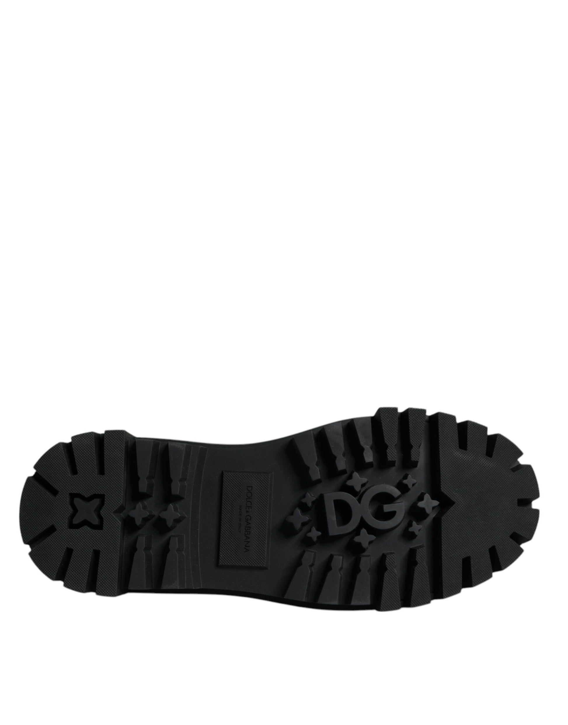 A single black leather lace up shoe with a star logo on the side, designed for trekking