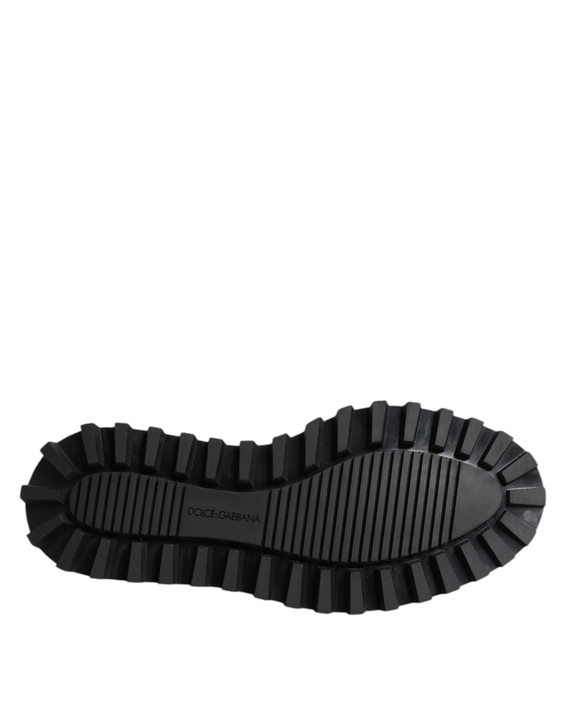 A pair of black leather lace up trekking shoes with a textured sole