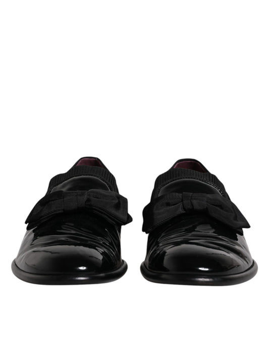 Pair of black leather loafers with silver buckle, men's formal dress shoes