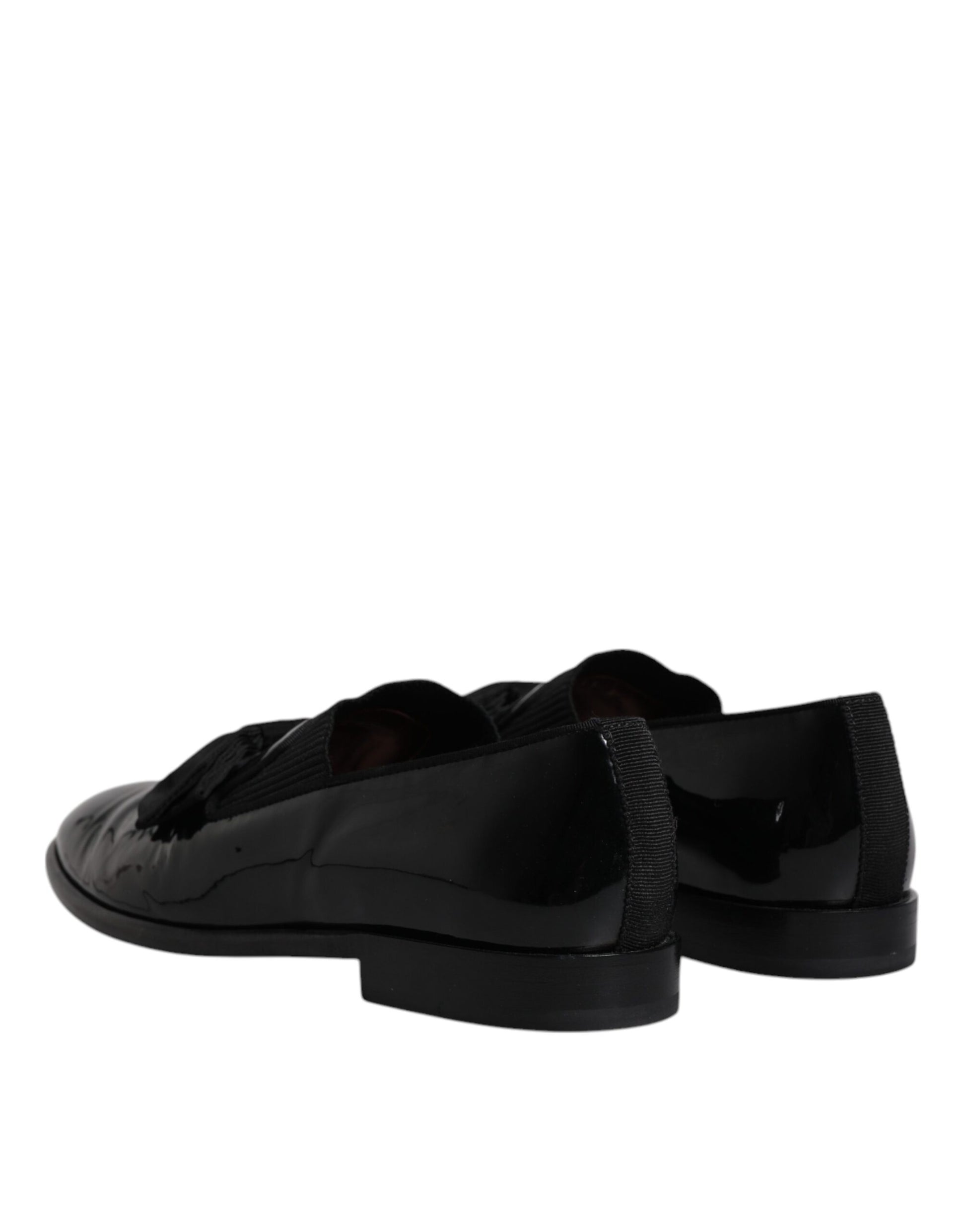Pair of black leather loafers with silver buckle, men's formal dress shoes