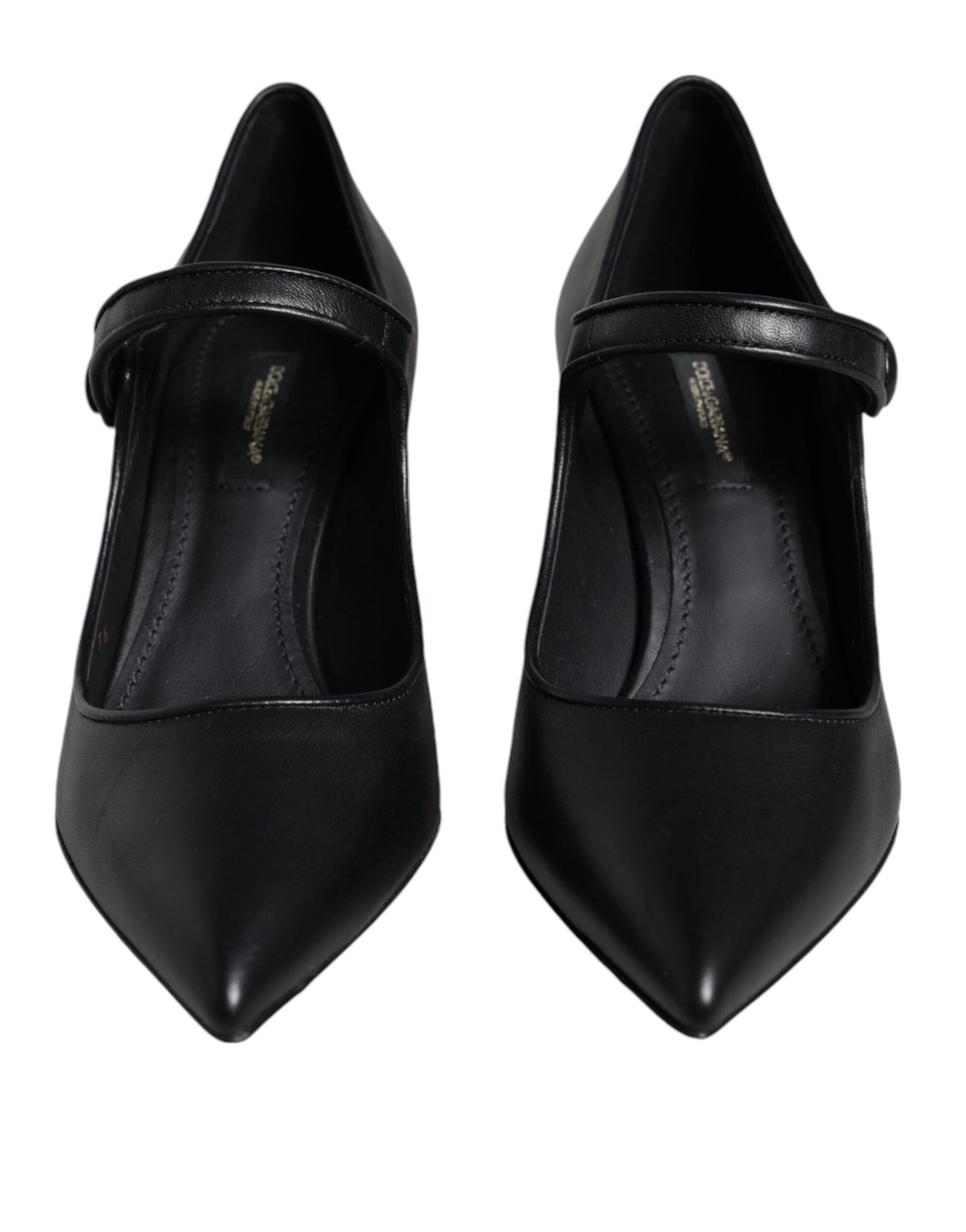 Pair of black high heel shoes with pointed toe and strap detailing