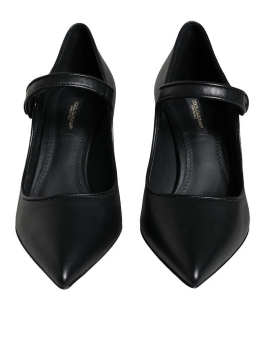 Pair of black high heel shoes with pointed toe and strap detailing