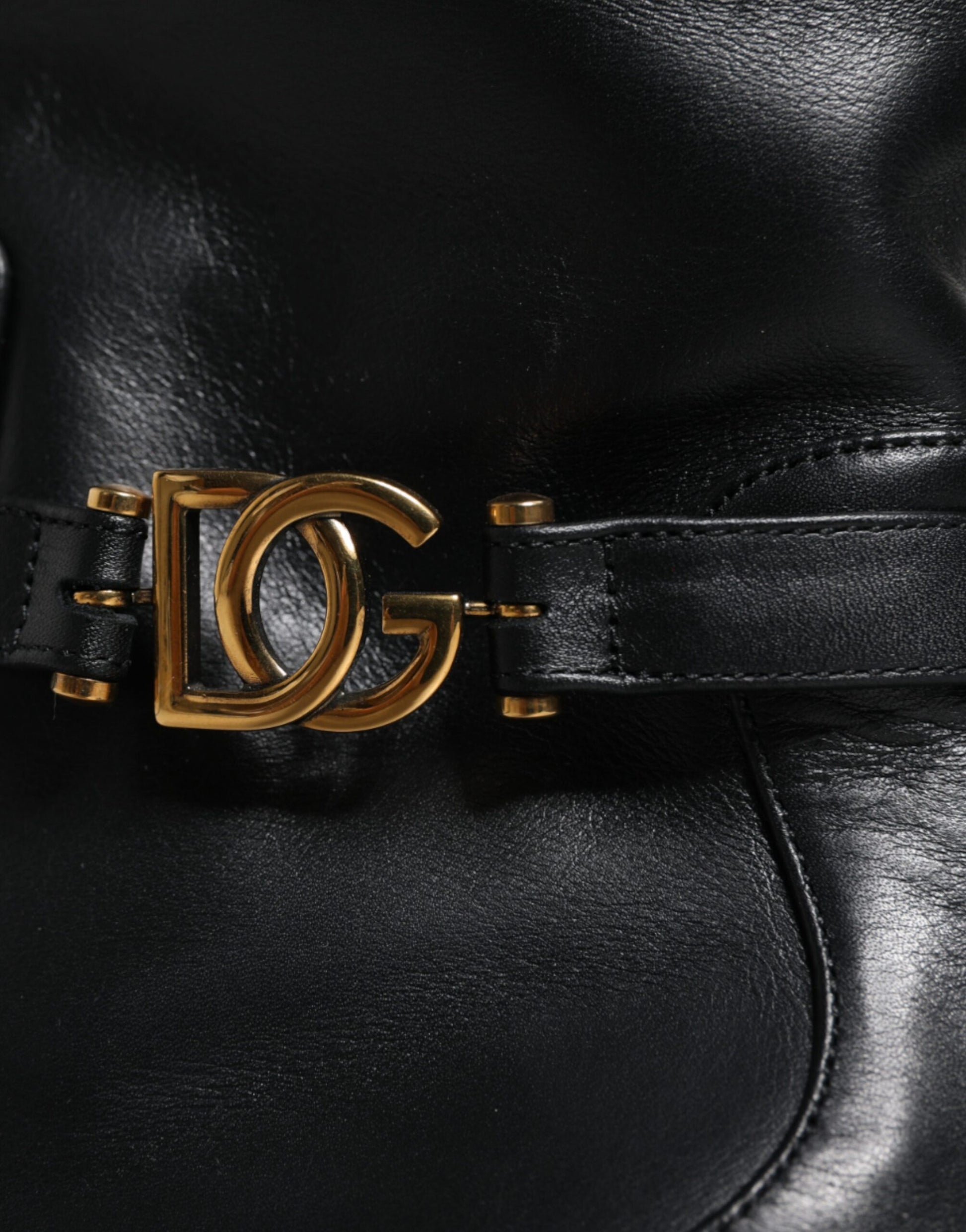 Black leather belt with gold buckle