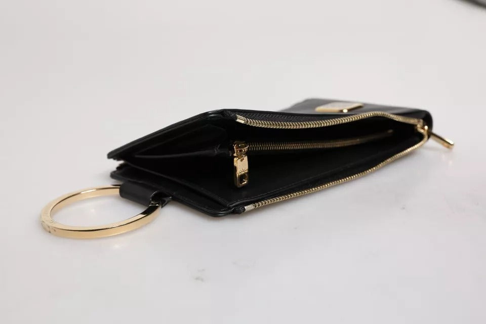 Black wallet with gold zipper pulls and key chain