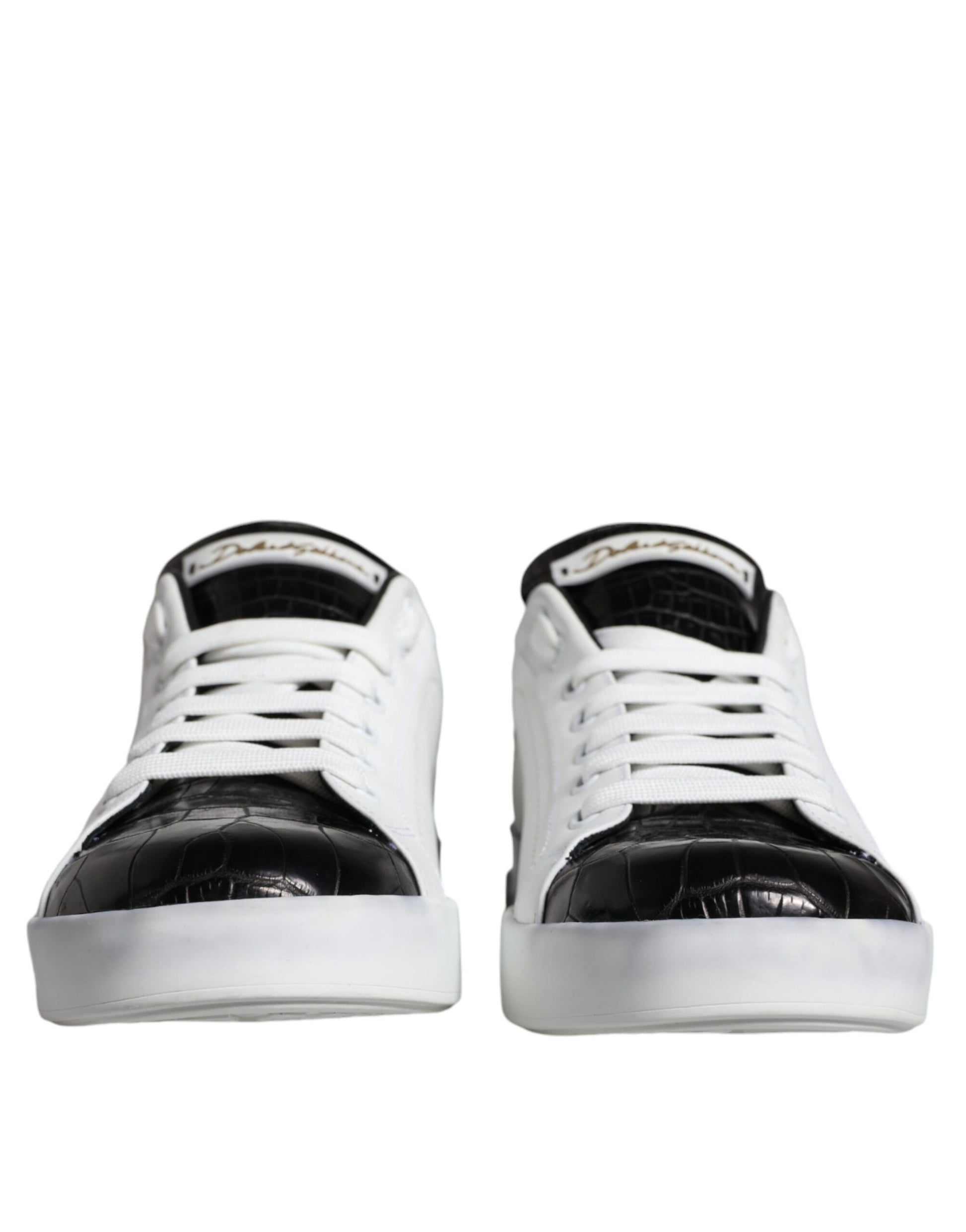 Pair of black leather sneakers with white laces and logo on side