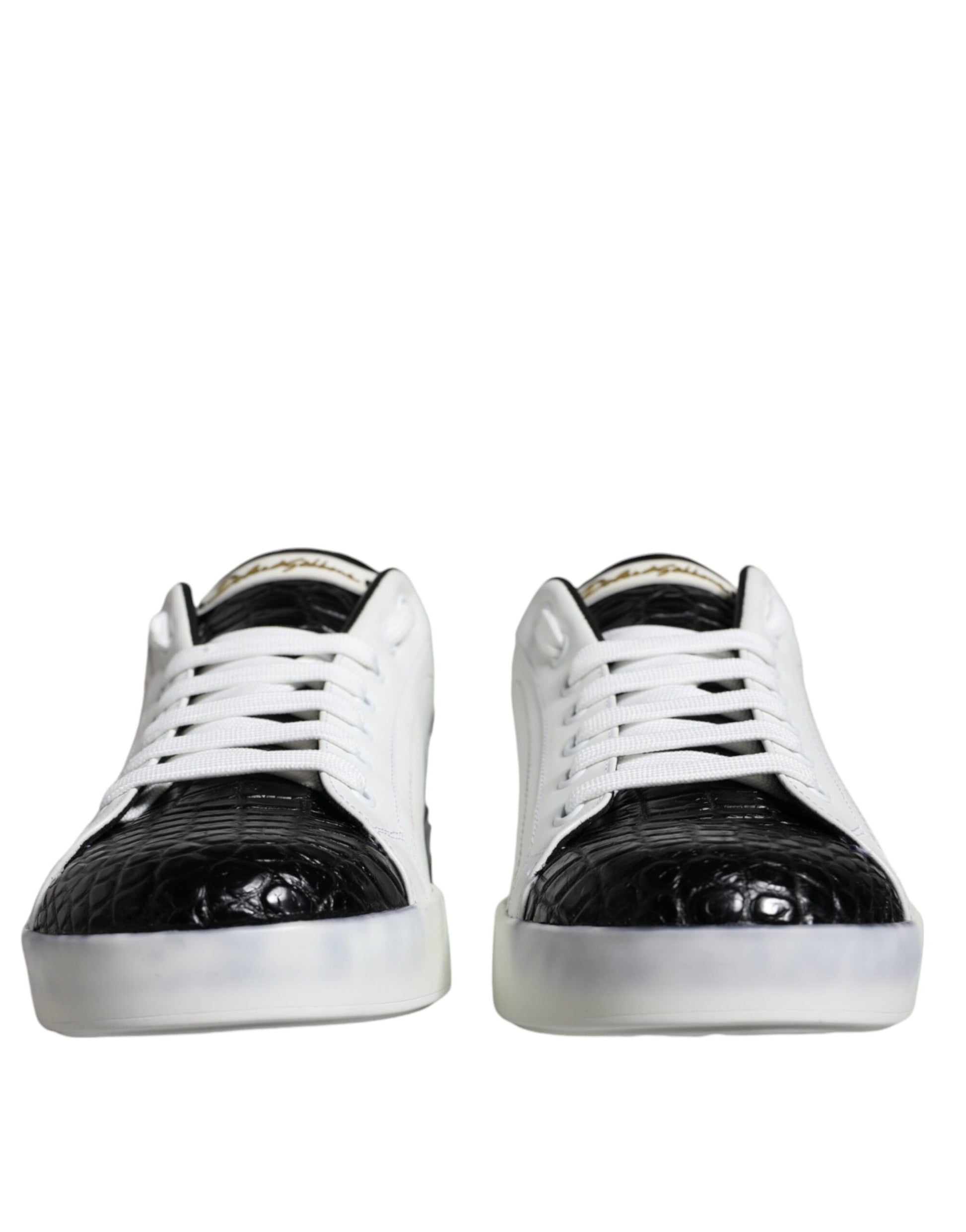 Pair of black leather sneakers with white laces and logo on side