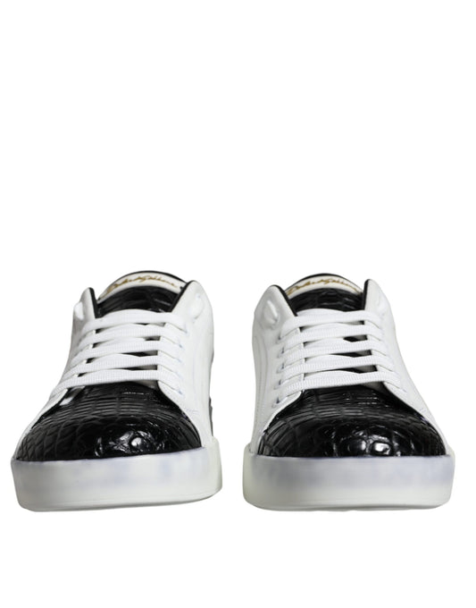 Pair of black leather sneakers with white laces and logo on side