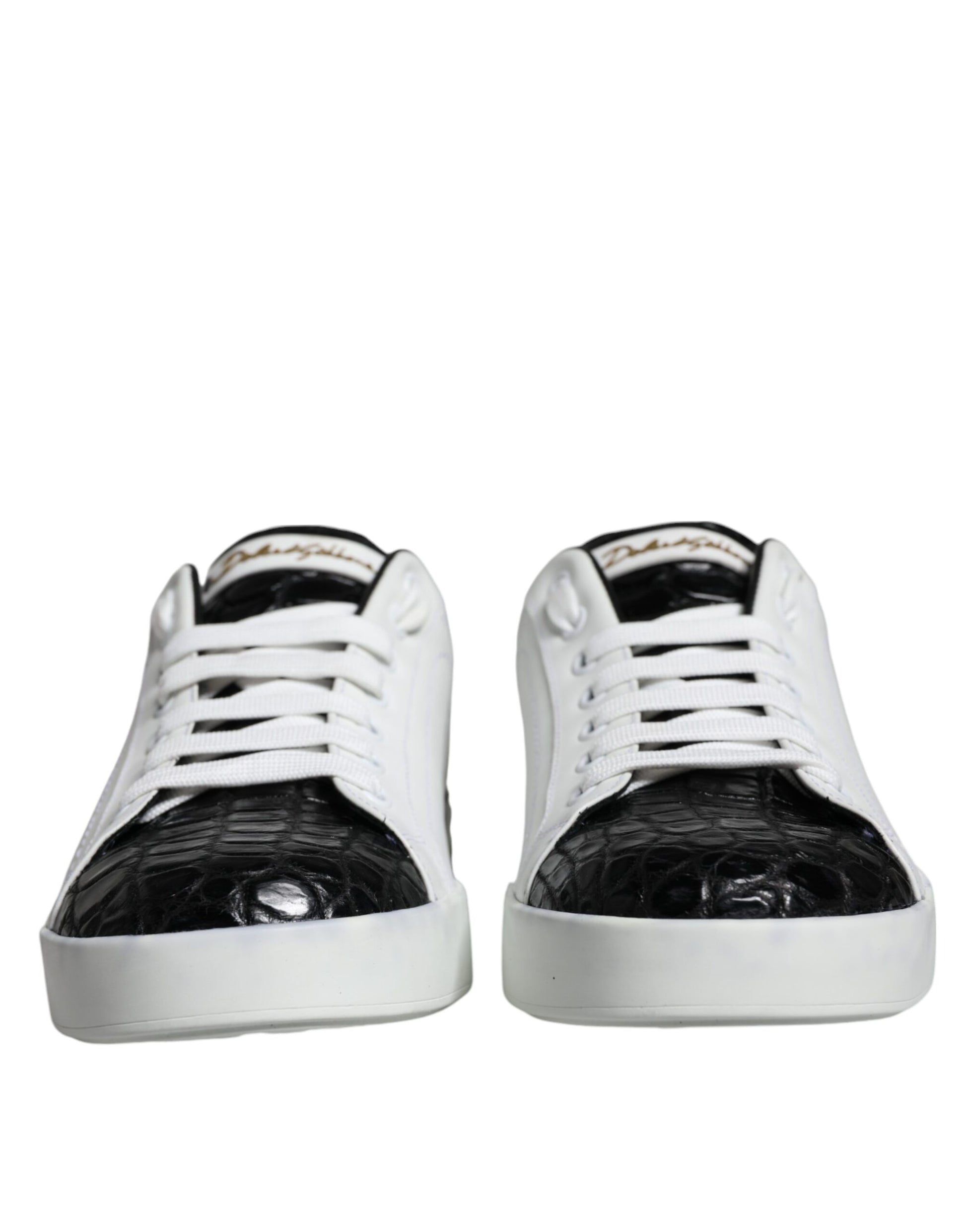 Pair of black leather sneakers with white laces and gold logo on side