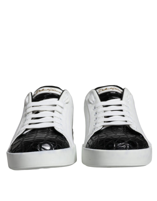 Pair of black leather sneakers with white laces and gold logo on side