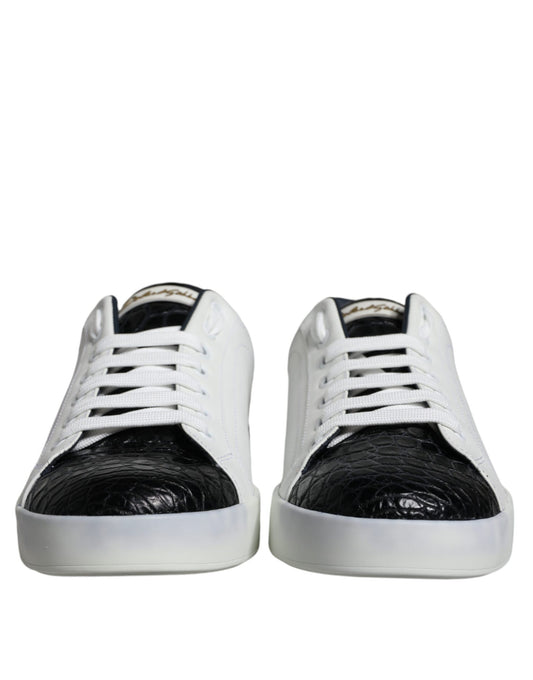 Pair of black leather sneakers with white laces and logo on side