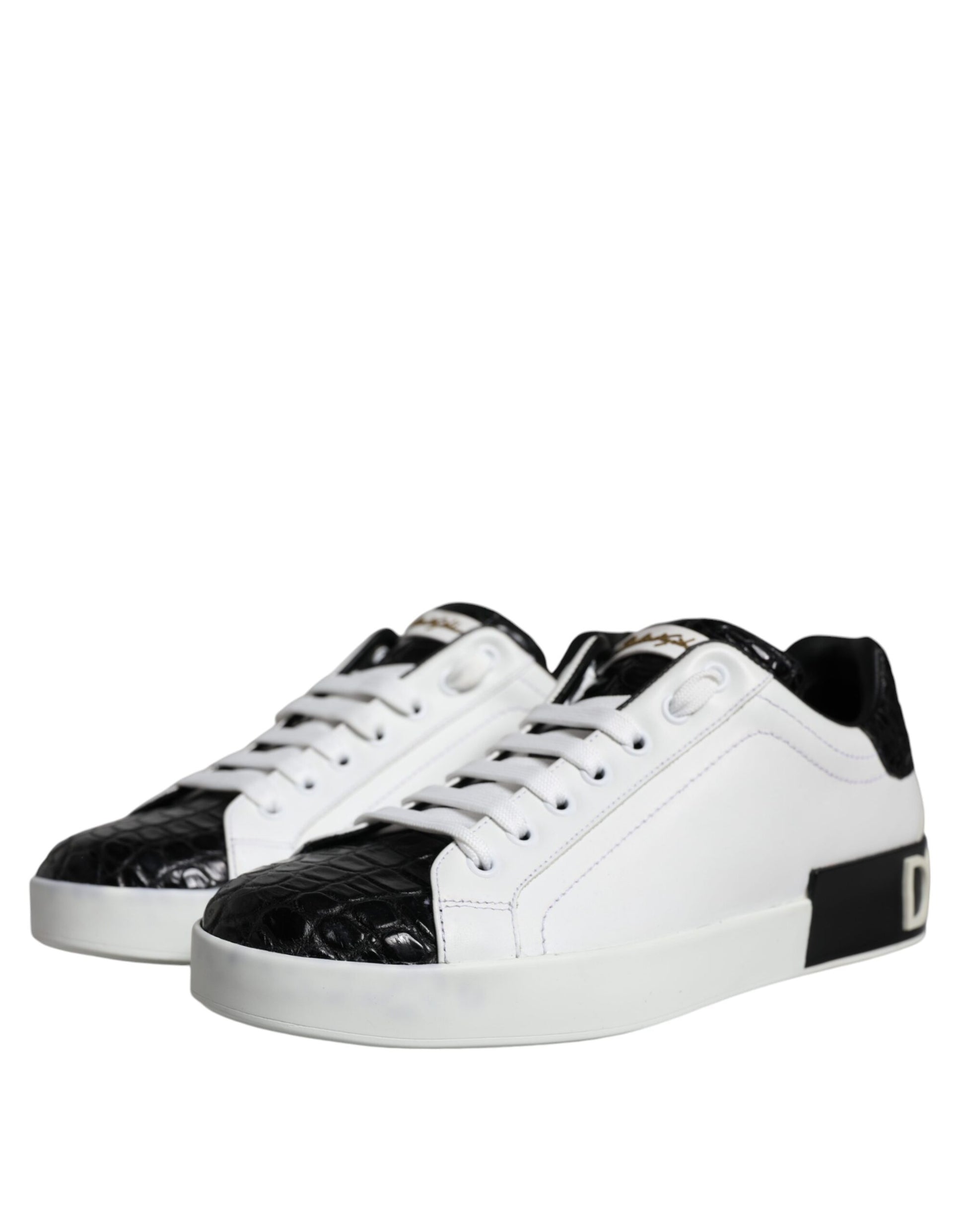 A pair of black leather sneakers with white laces and a logo on the side