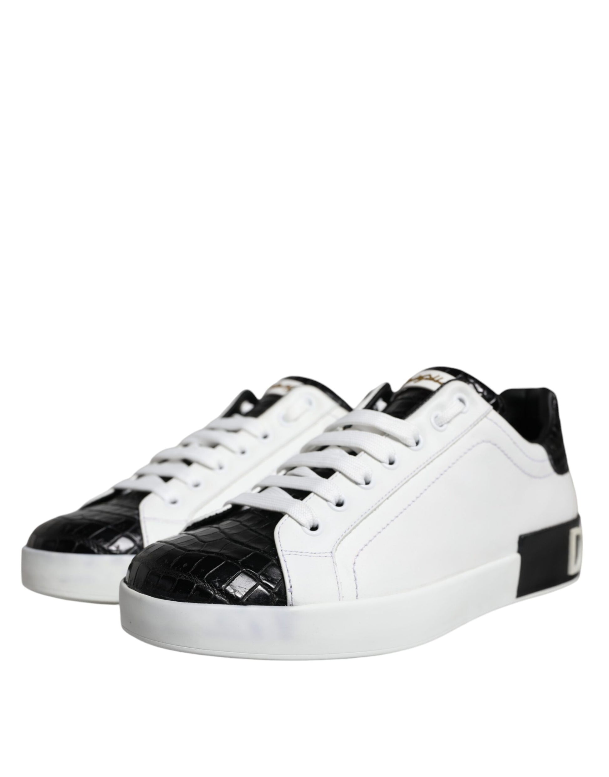 A pair of black leather sneakers with white laces and a logo on the side