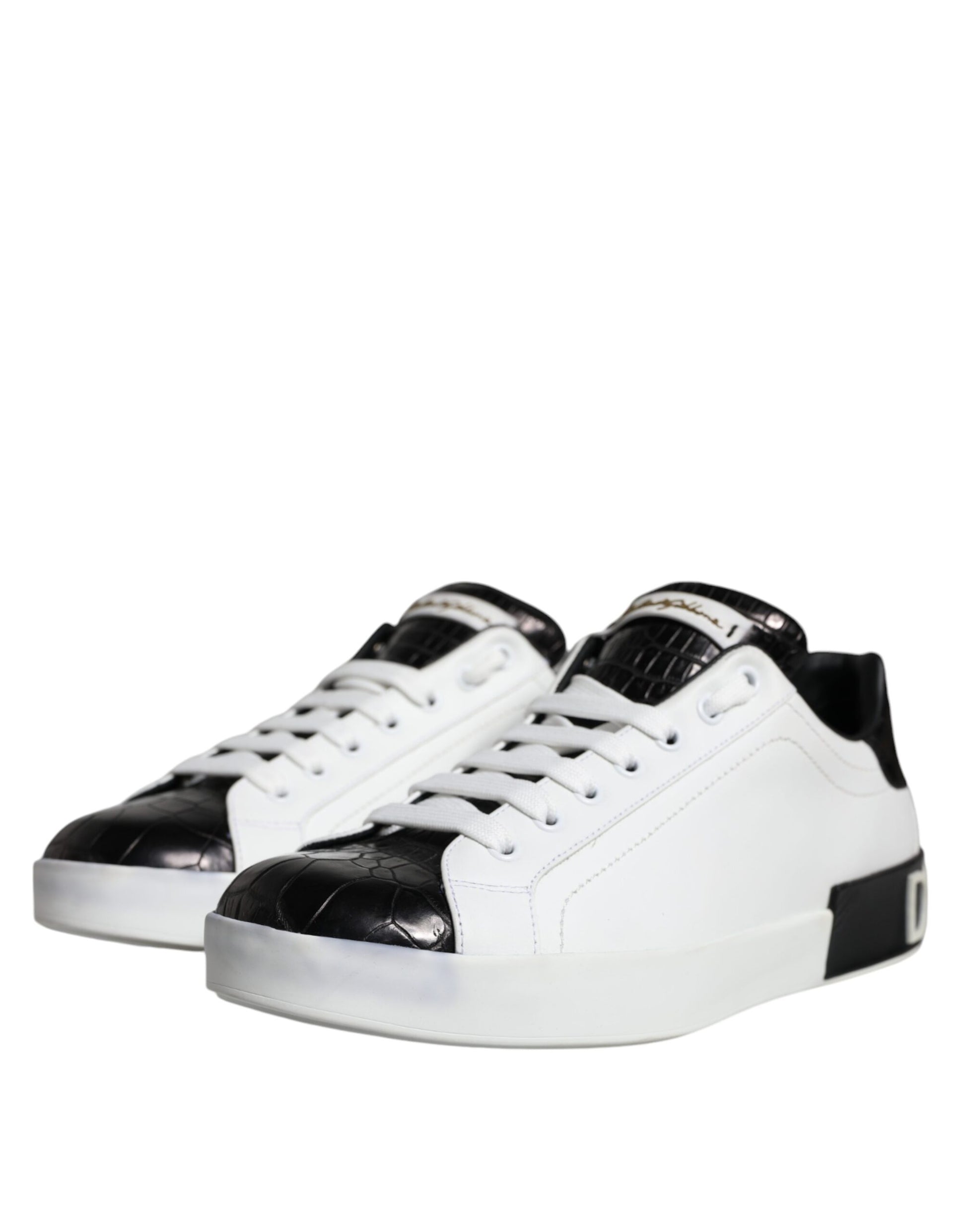 A pair of black leather sneakers with white laces and a logo on the side