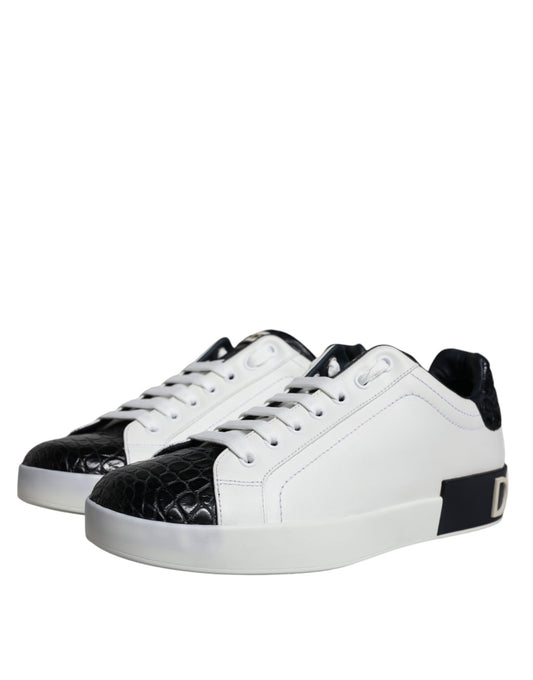 A pair of black leather sneakers with white laces and a logo on the side