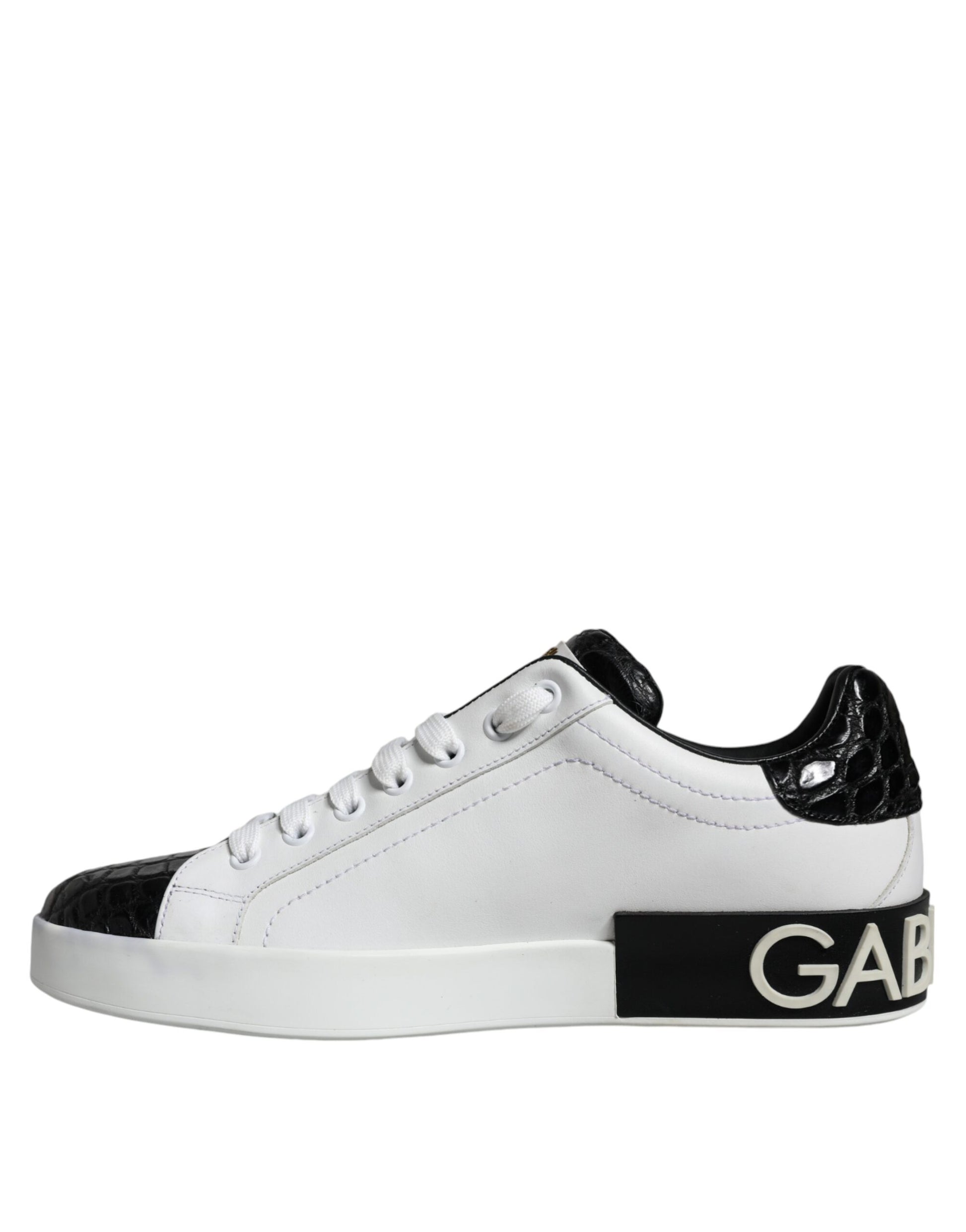 White sneakers with black laces, featuring a logo on the side and a black stripe