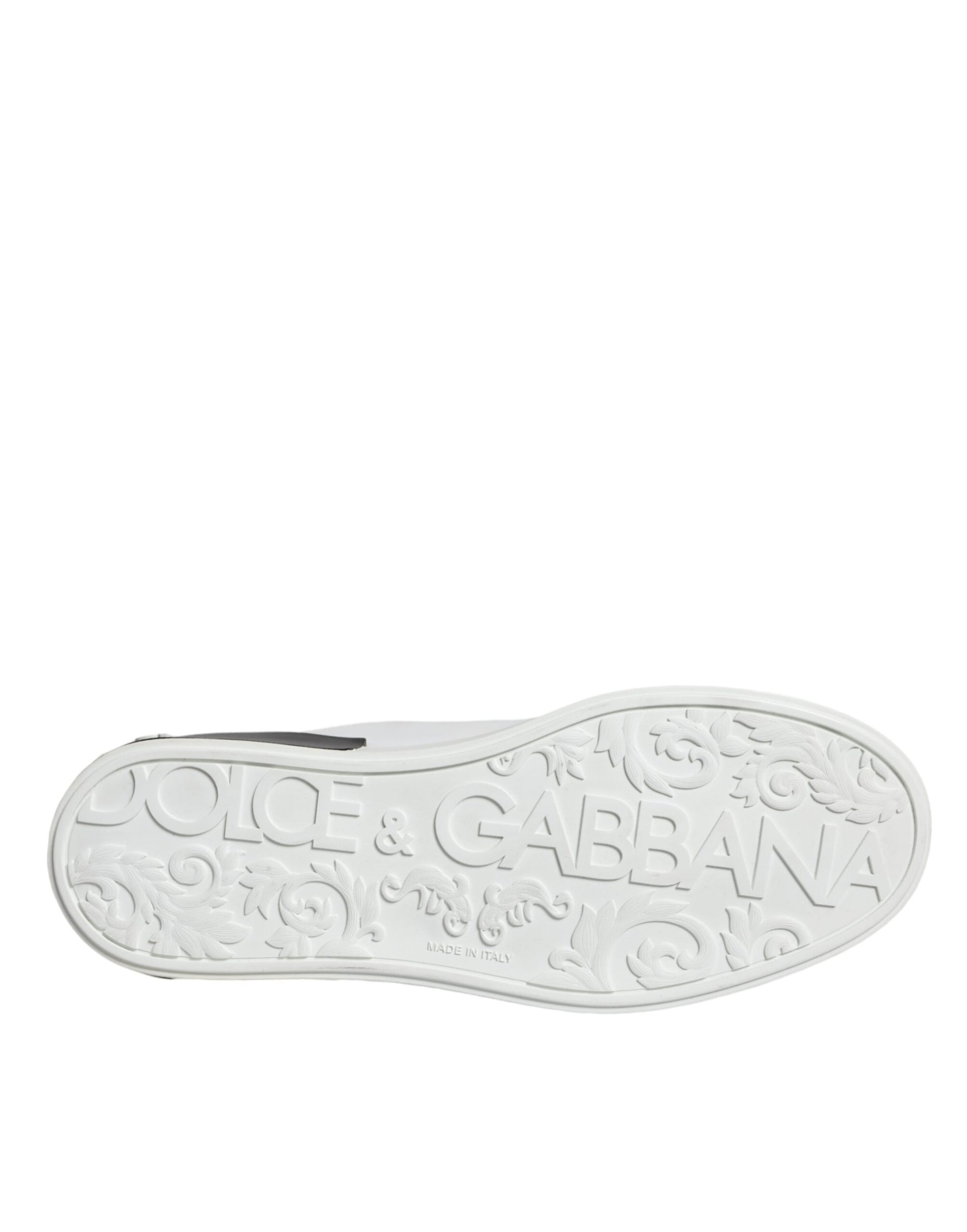 A black leather shoe with a logo on the side, featuring the words "Dolce & Gabbana" and "Portofino"