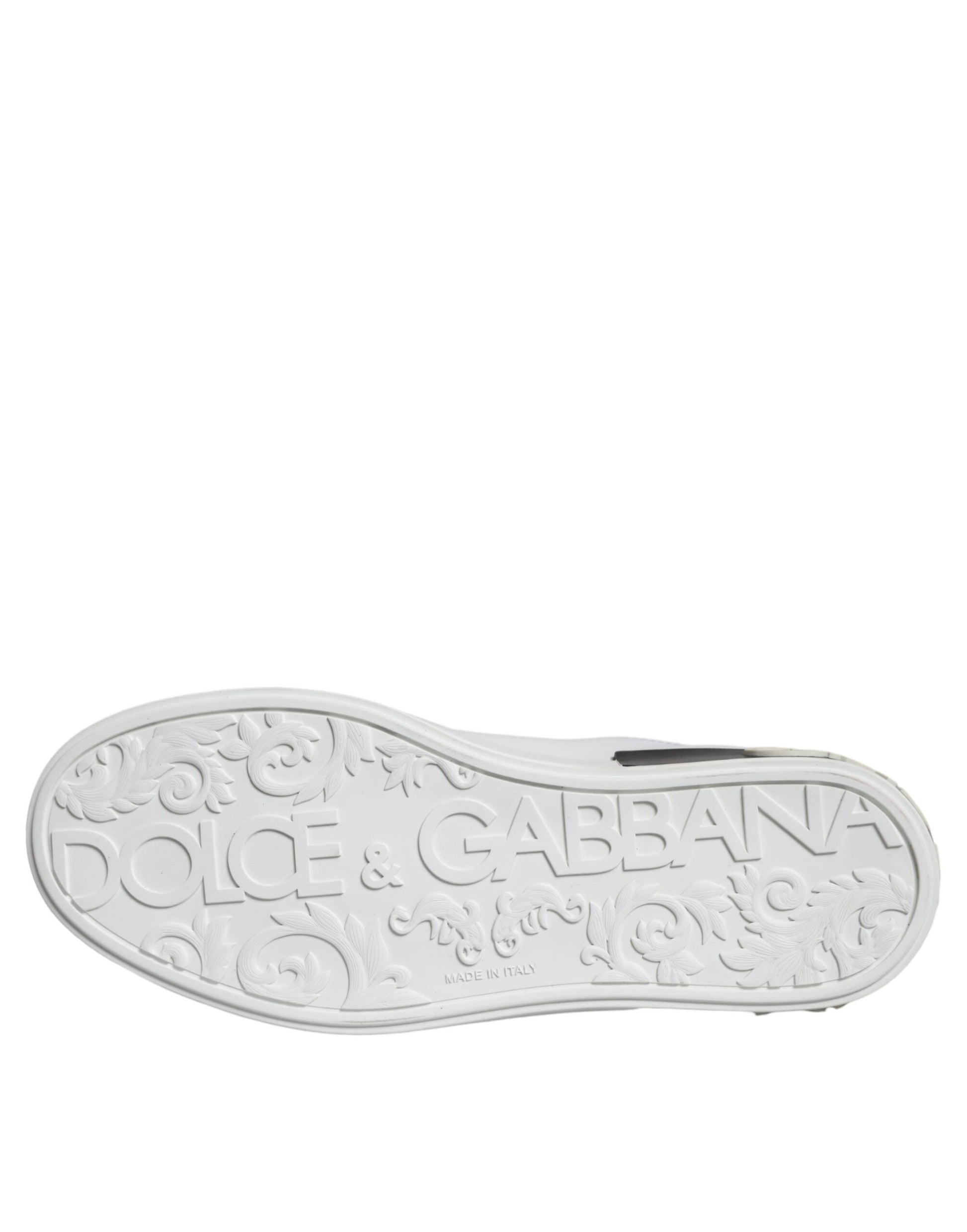 A single black leather shoe with a logo on the side, featuring the brand name "Dolce & Gabbana" and other text