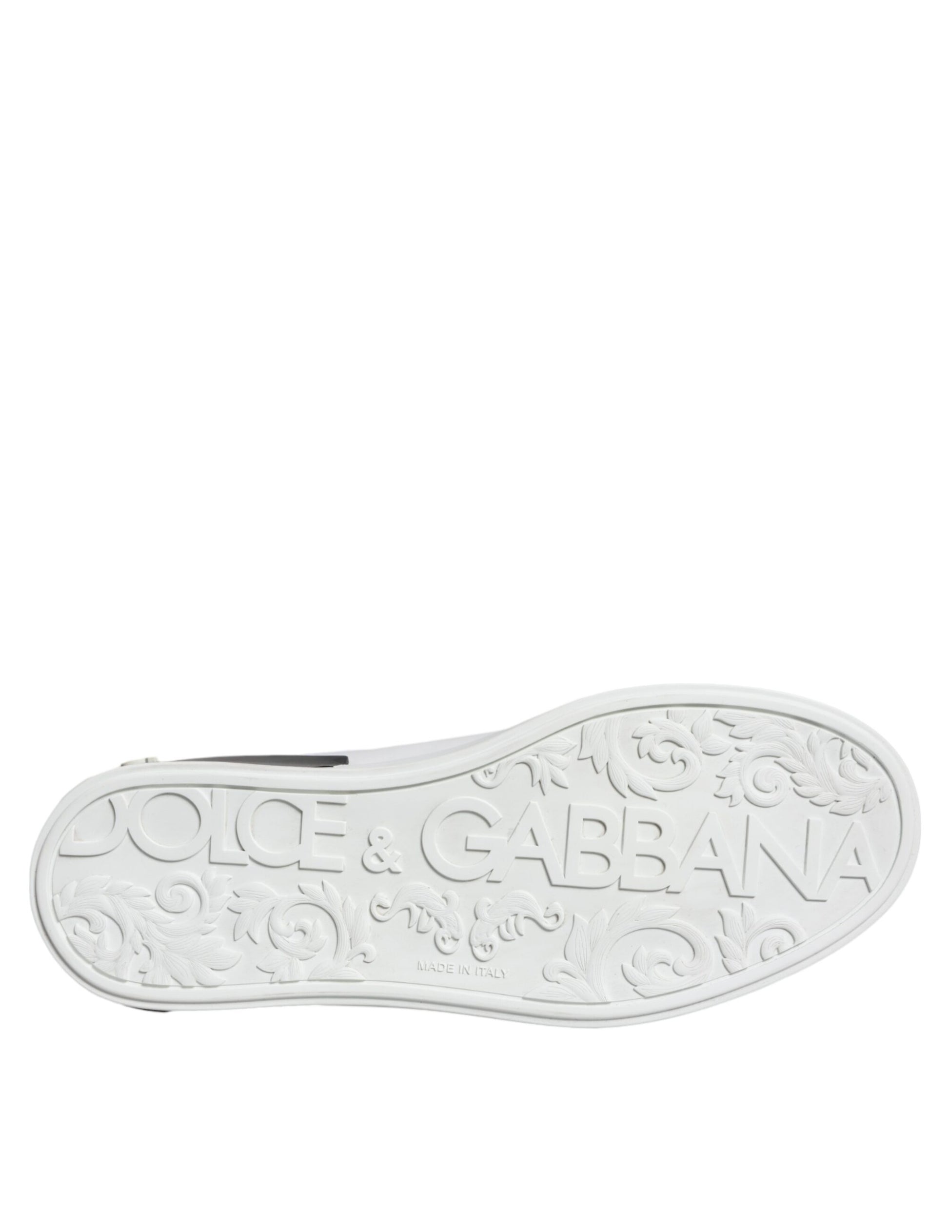 A black leather shoe with a logo on the side, featuring the brand name "Dolce & Gabbana" and the word "Portofino"
