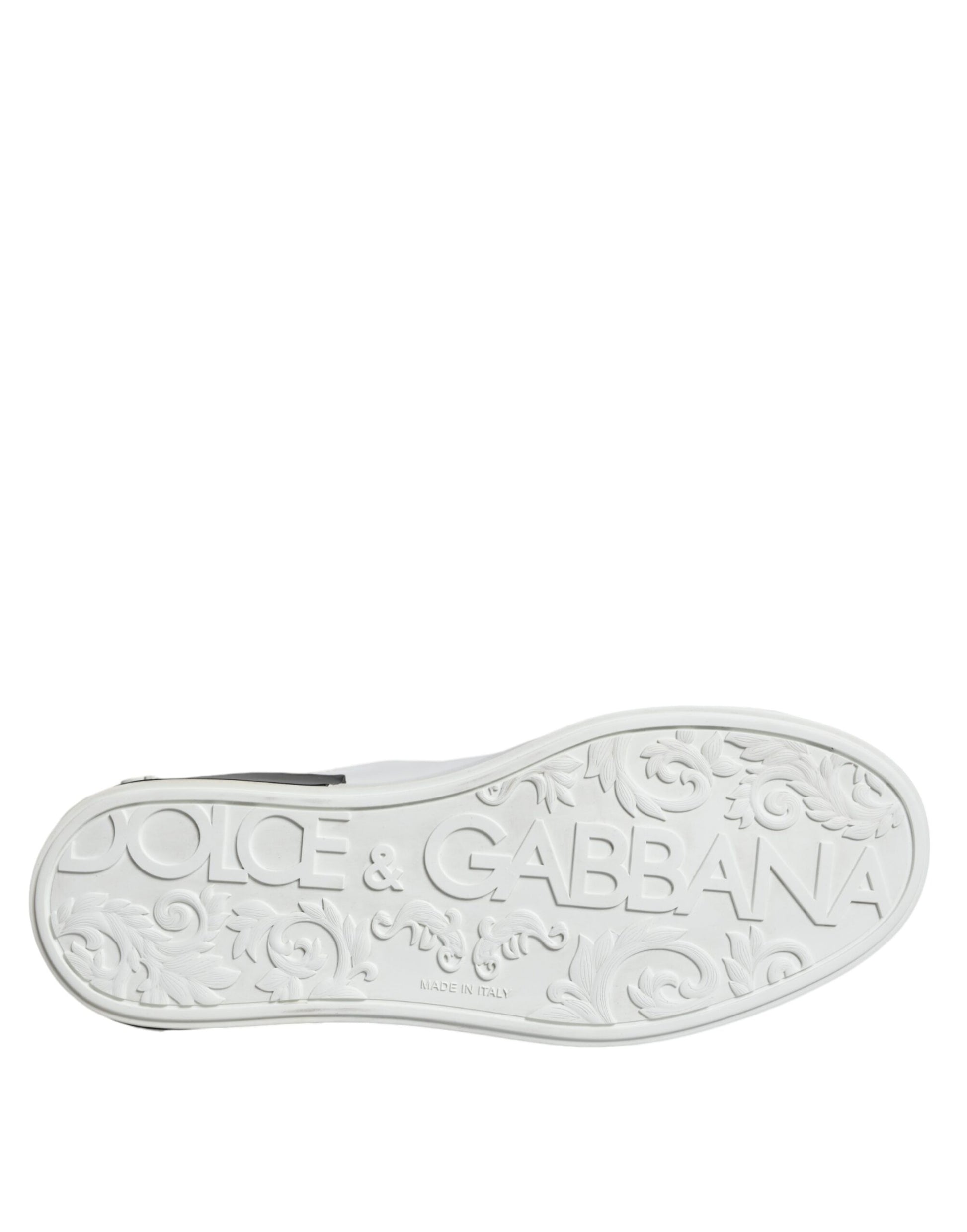 A black leather shoe with a logo on the side, featuring the brand name "Dolce & Gabbana"