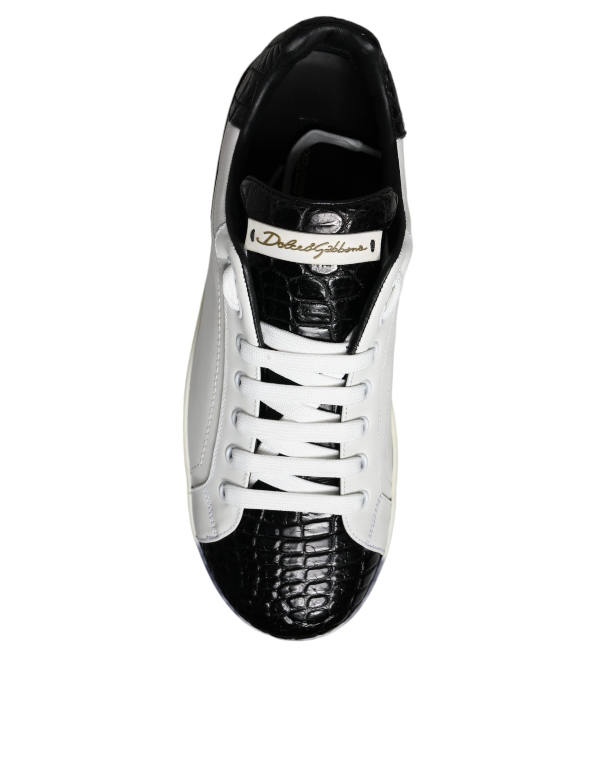 A black leather sneaker with white laces and a logo on the side