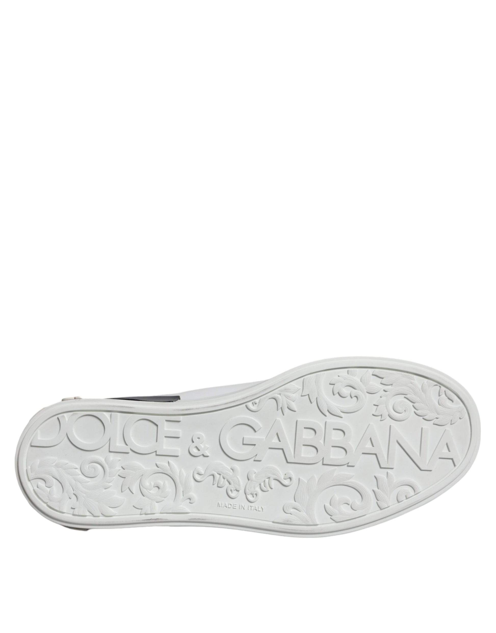 A black leather shoe with a logo on the side, featuring the brand name "Dolce & Gabbana"