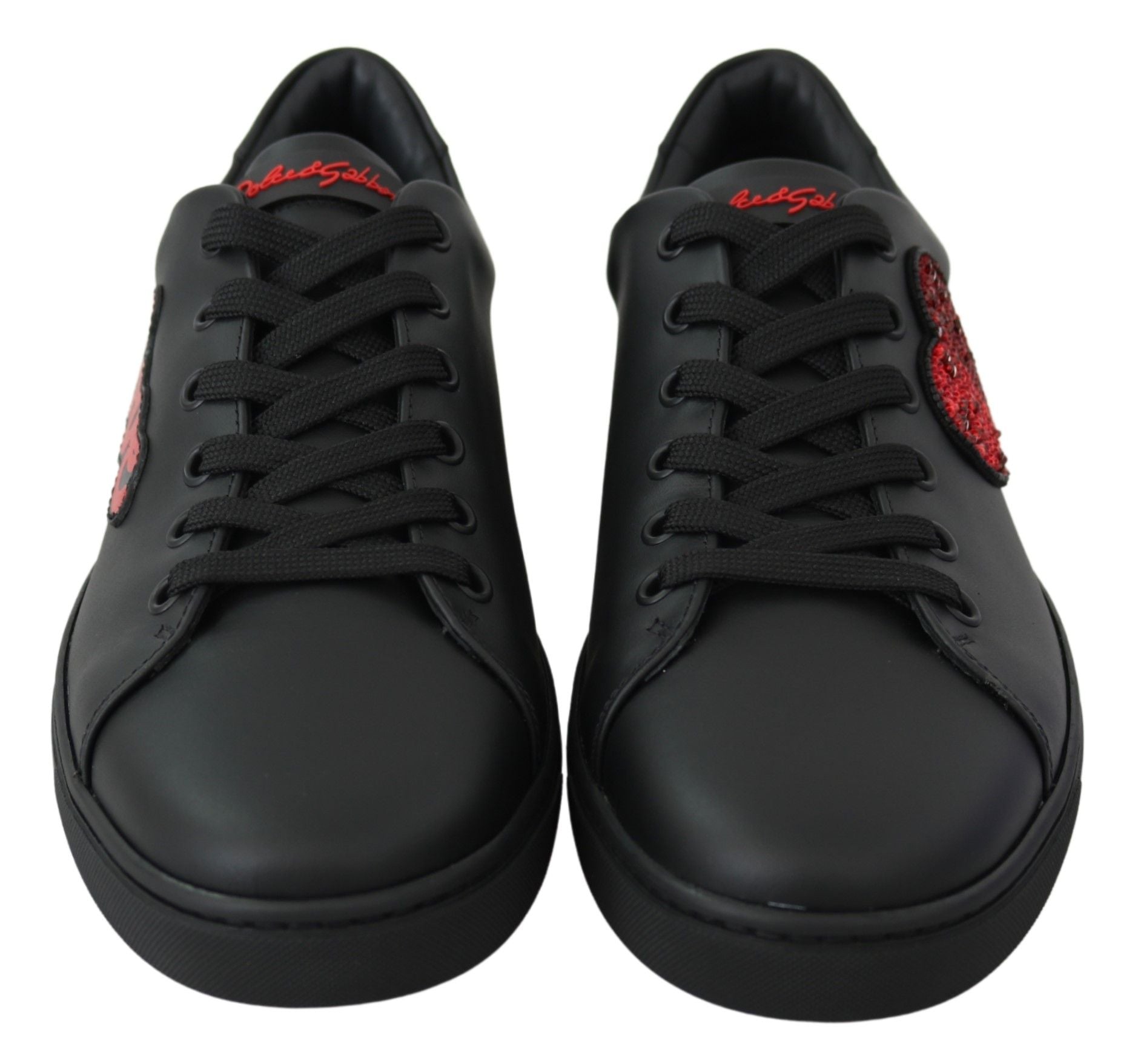 Pair of black sneakers with red laces and logo on side
