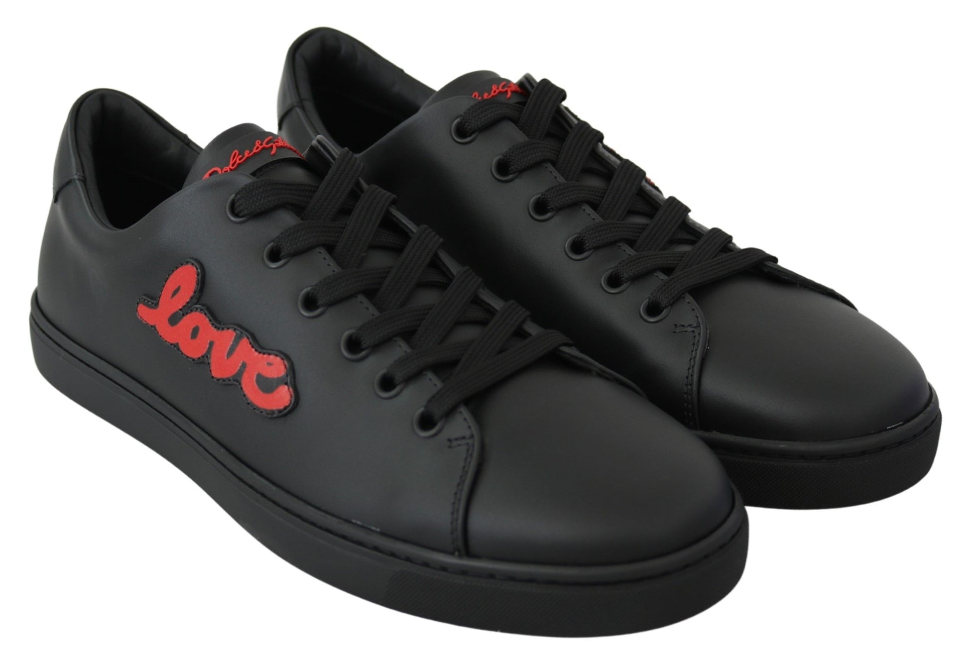 Pair of black sneakers with red laces and a white logo on the side