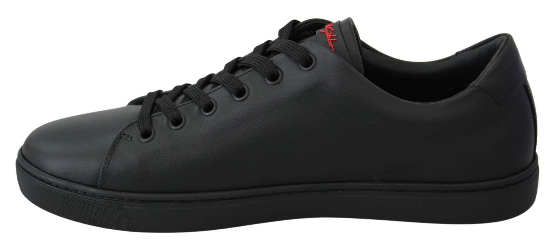 Black sneakers with white soles and red logo on side