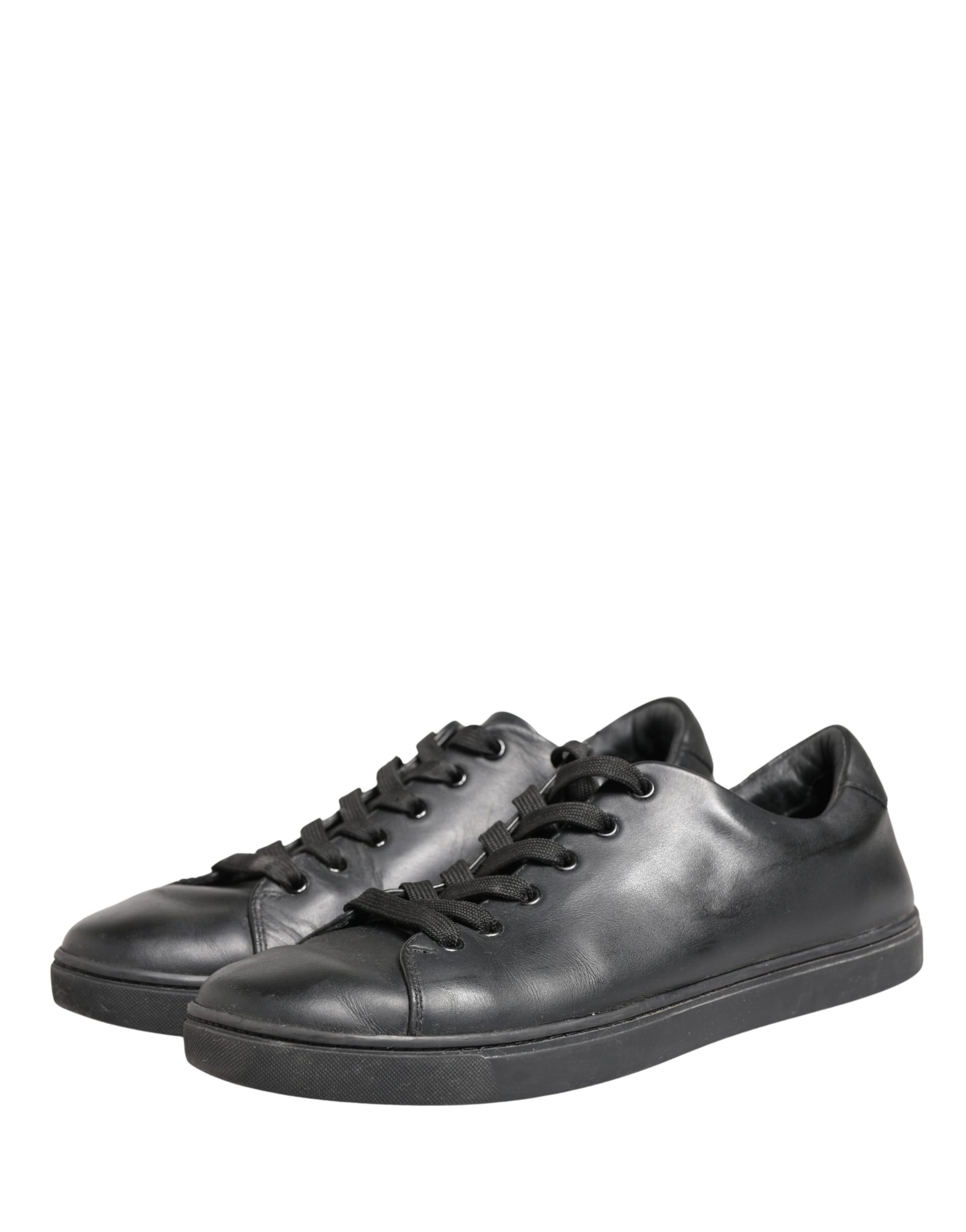 Pair of black leather lace-up sneakers with white soles