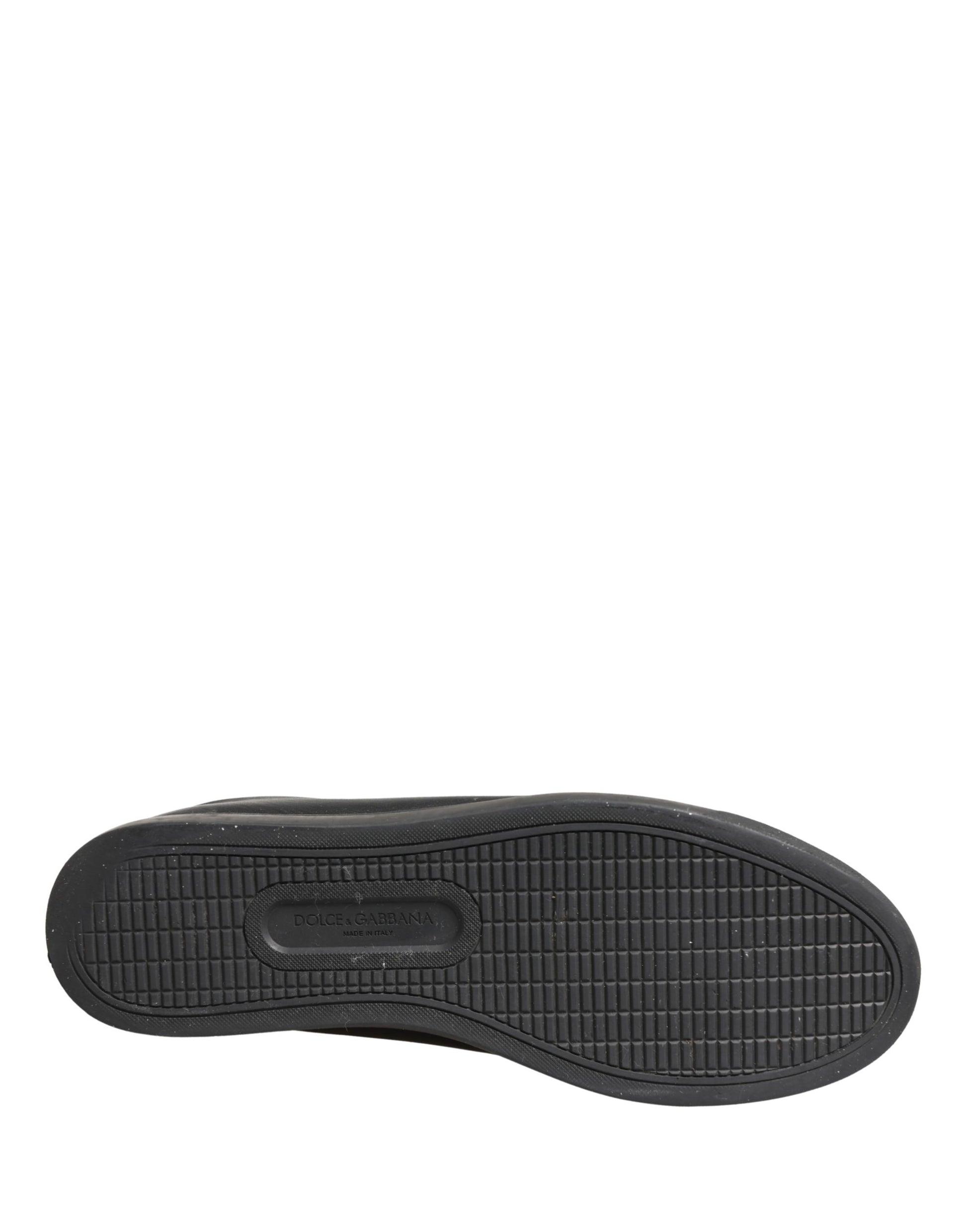 A single black leather shoe with a low top and lace-up design, featuring the brand name on the side