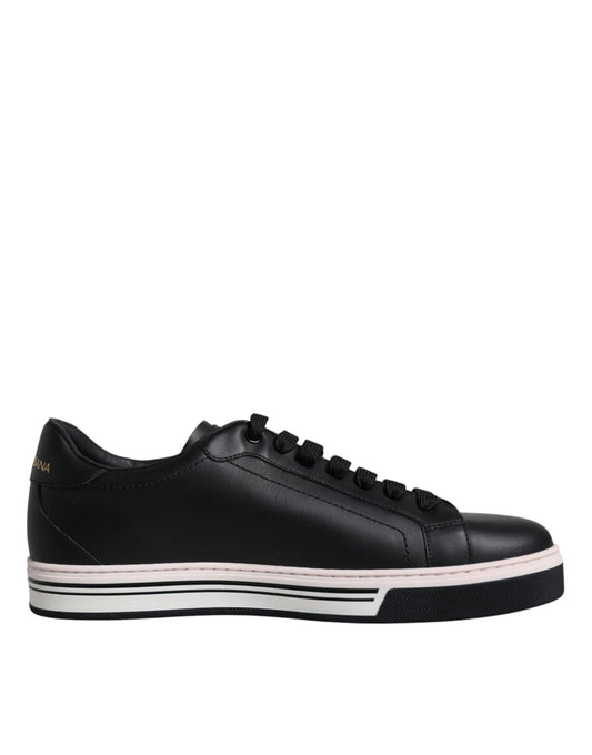 Black sneaker with white sole and pink accents