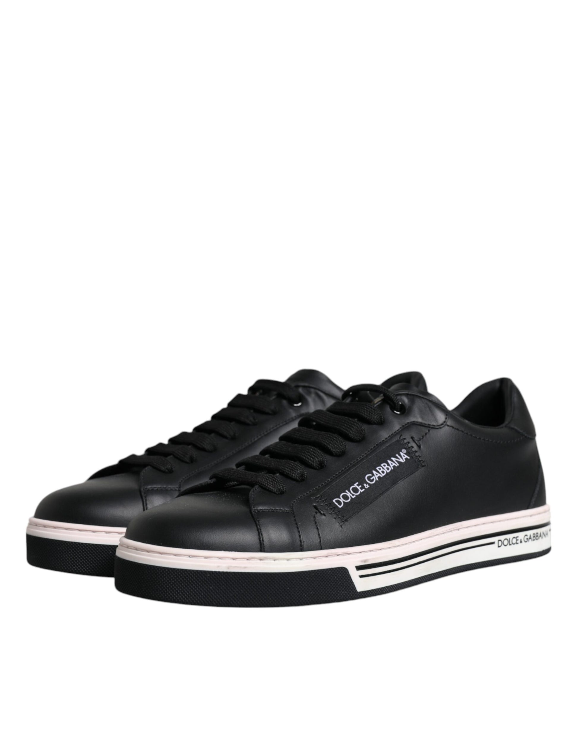 Pair of black sneakers with pink accents and white soles
